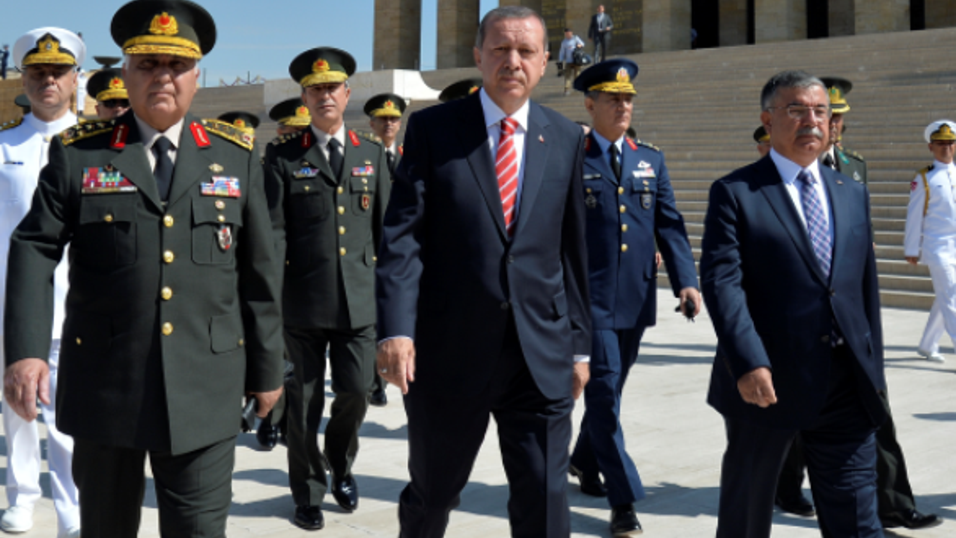 Turkish President Erdogan (C), with now-Education Minister Yilmaz (R), who announced that evolution will no longer be taught to schoolchildren in Turkey.
