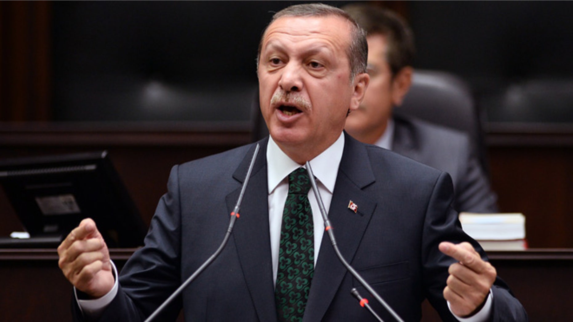 June 25, 2013: Turkish Prime Minister Recep Tayyip Erdogan addresses his supporters and lawmakers at the parliament in Ankara, Turkey.