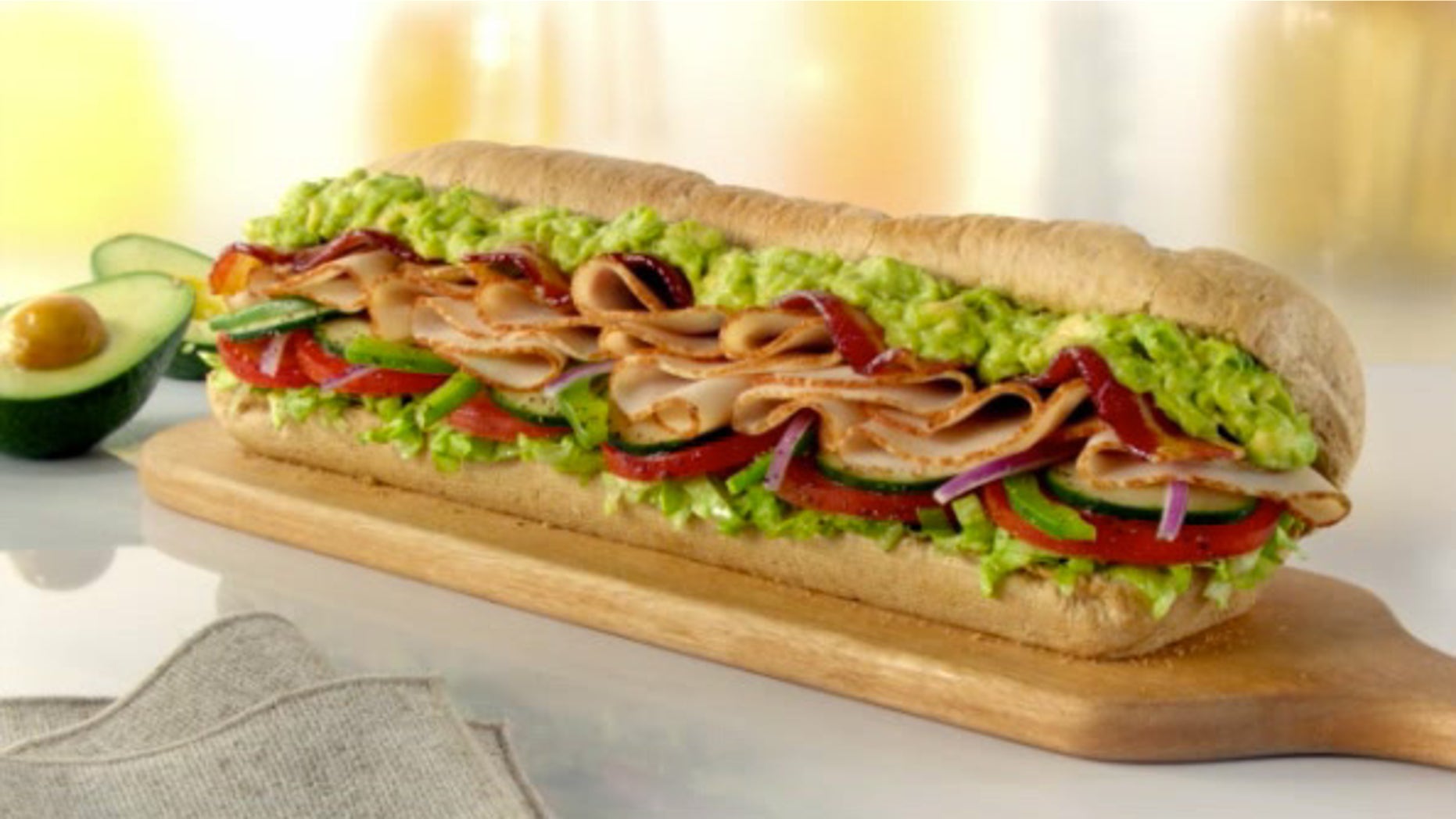 A turkey bacon sandwich with avocado.