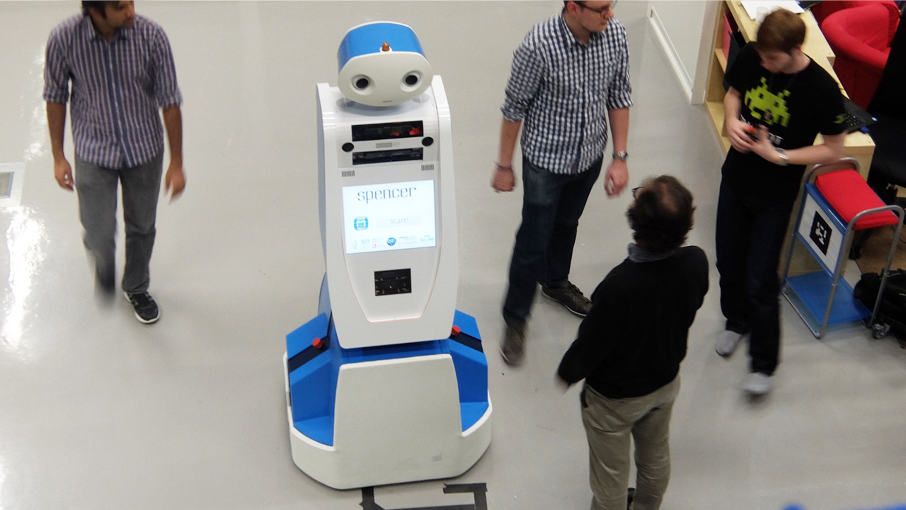 Spencer the robot helps airline passengers navigate through busy terminals.