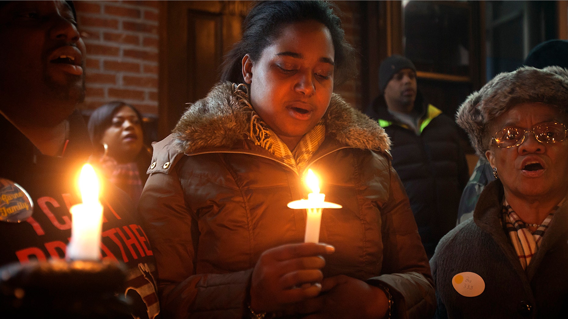 Erica Garner — whose father Eric Garner became a symbol of police brutality when he died after being placed in a chokehold — was in a coma Sunday night after suffering a heart attack, family members said.