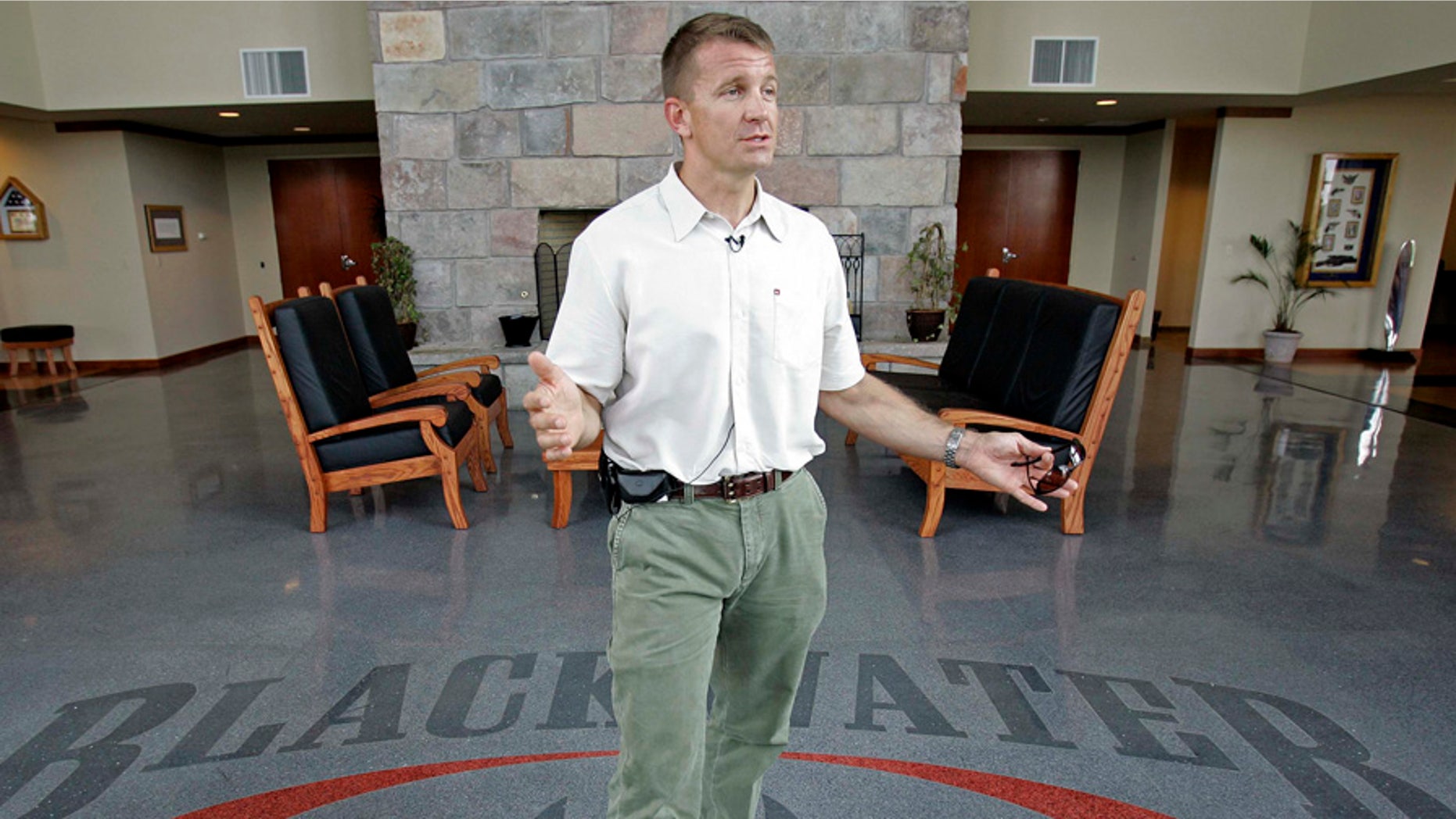 FILE - In a July, 21, 2008, file photo, founder and CEO of Blackwater Worldwide Erik Prince talks at Blackwater's offices in Moyock, N.C. Prince is considering a challenge to Republican Sen. John Barrasso, according to a person familiar with Prince's thinking. (AP Photo/Gerry Broome, File)