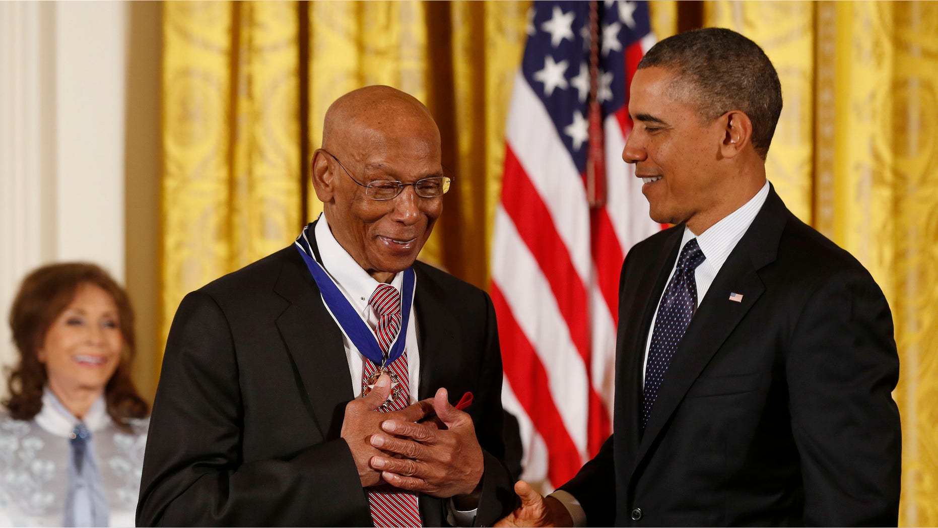 Nov. 20, 2013: Baseball Hall of Fame player Ernie Banks reacts after receiving the Presidential Medal of Freedom from U.S. President Barack Obama.