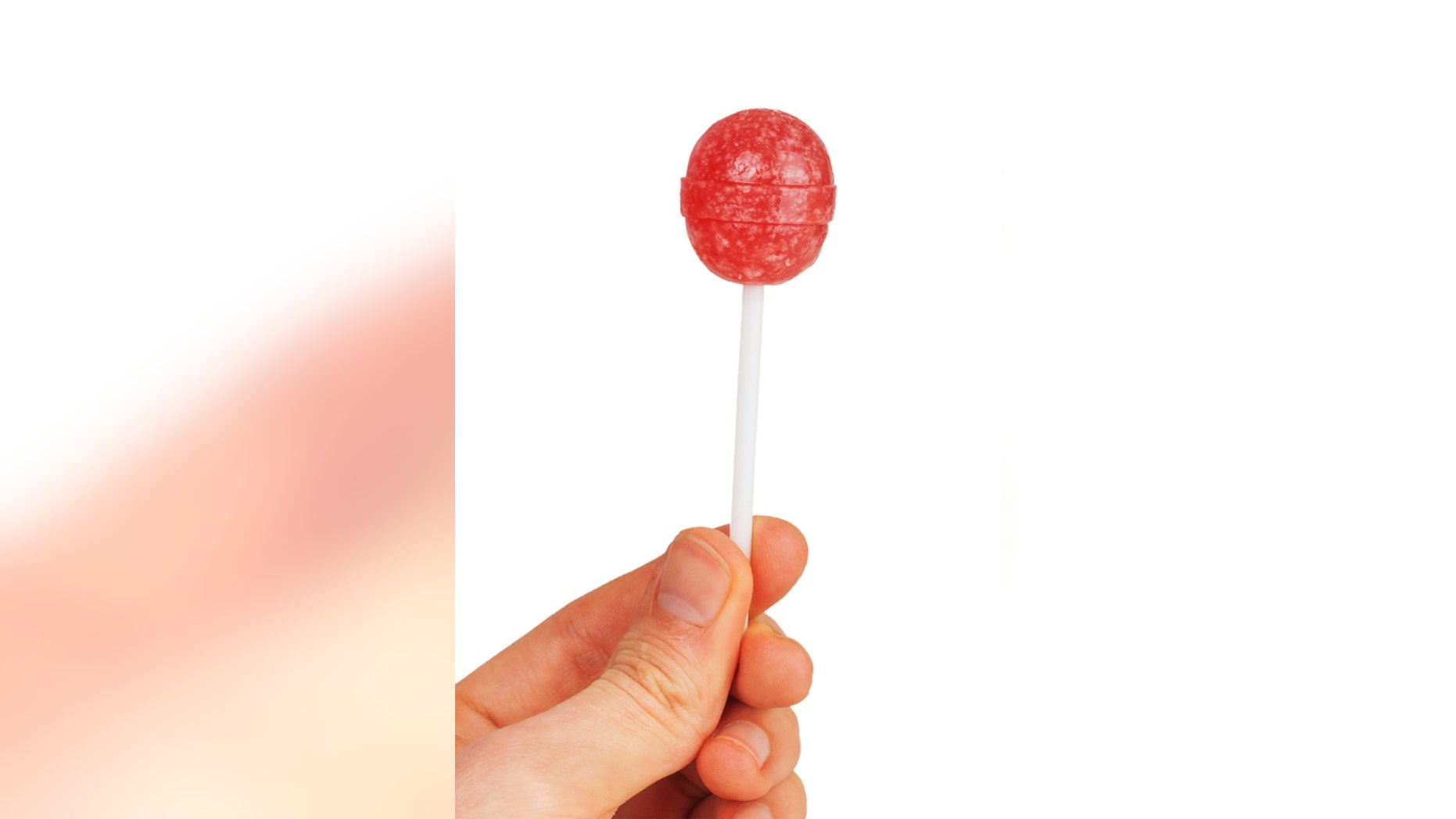 Man hand with lollipop isolated on white background