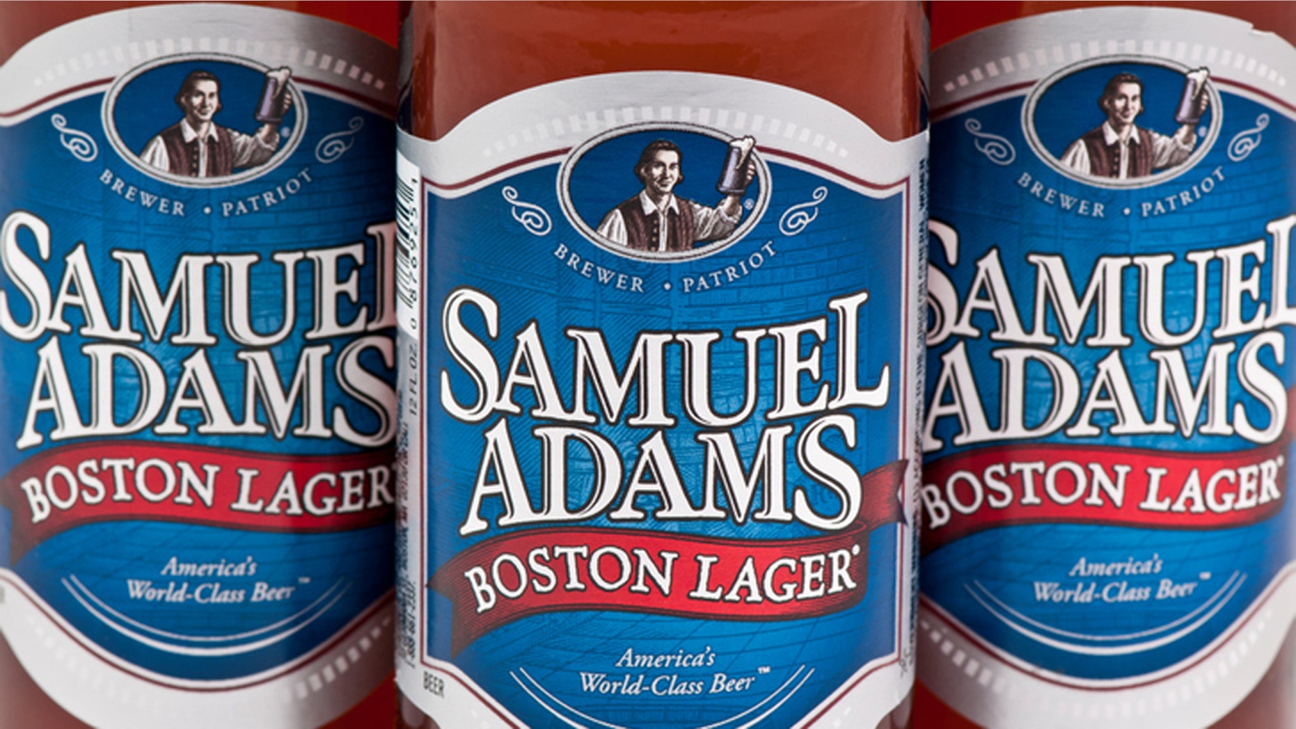 Marietta GA, USA - February 10, 2012: Close up of Samual Adams Boston Lager, 12 fl oz bottles. Samuel Adams is an American Craft Brewer defined as Small, Independent, and Traditional. Their Boston Lager is an excellent example of the fundamentals of a beer offering a full, rich flavor resulting from hand selected ingredients and traditional four vessel brewing.