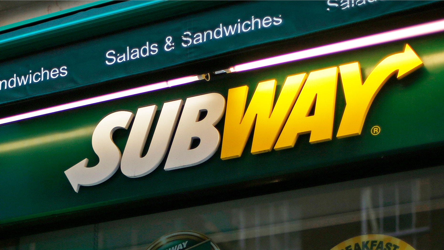 A man walks past a Subway sandwich store in central London January 22, 2014. Subway, one of the largest fast-food chains in the world, plans to open over 1,200 new stores in the UK and Ireland by 2020, creating another 13,000 jobs, it said on Wednesday.
REUTERS/Andrew Winning (BRITAIN - Tags: BUSINESS EMPLOYMENT) - RTX17PRP