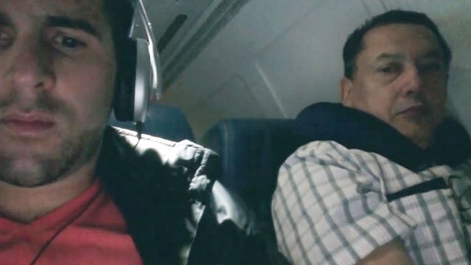 Busted. Clever flyer finds a way to catch a snooping seatmate.