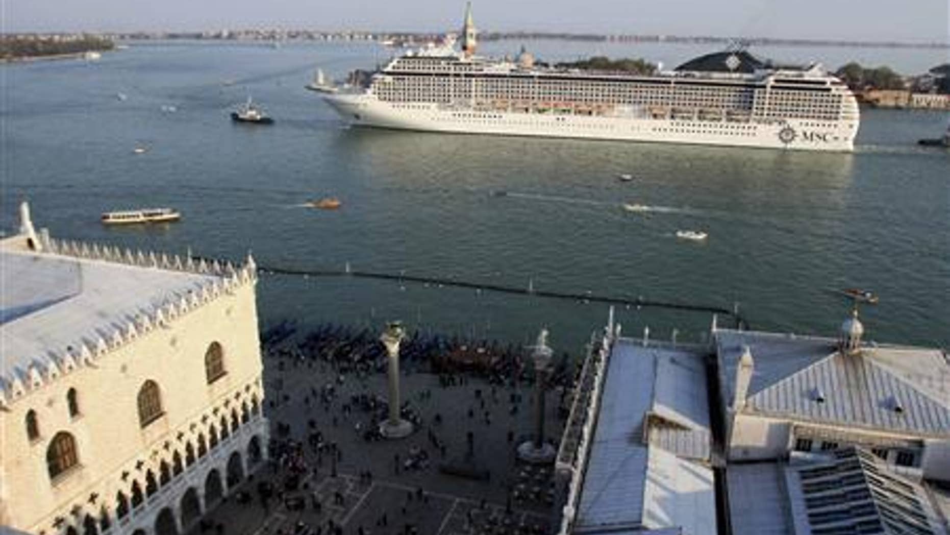 A cruise ship sails in the Venice lagoon close to Doge.
