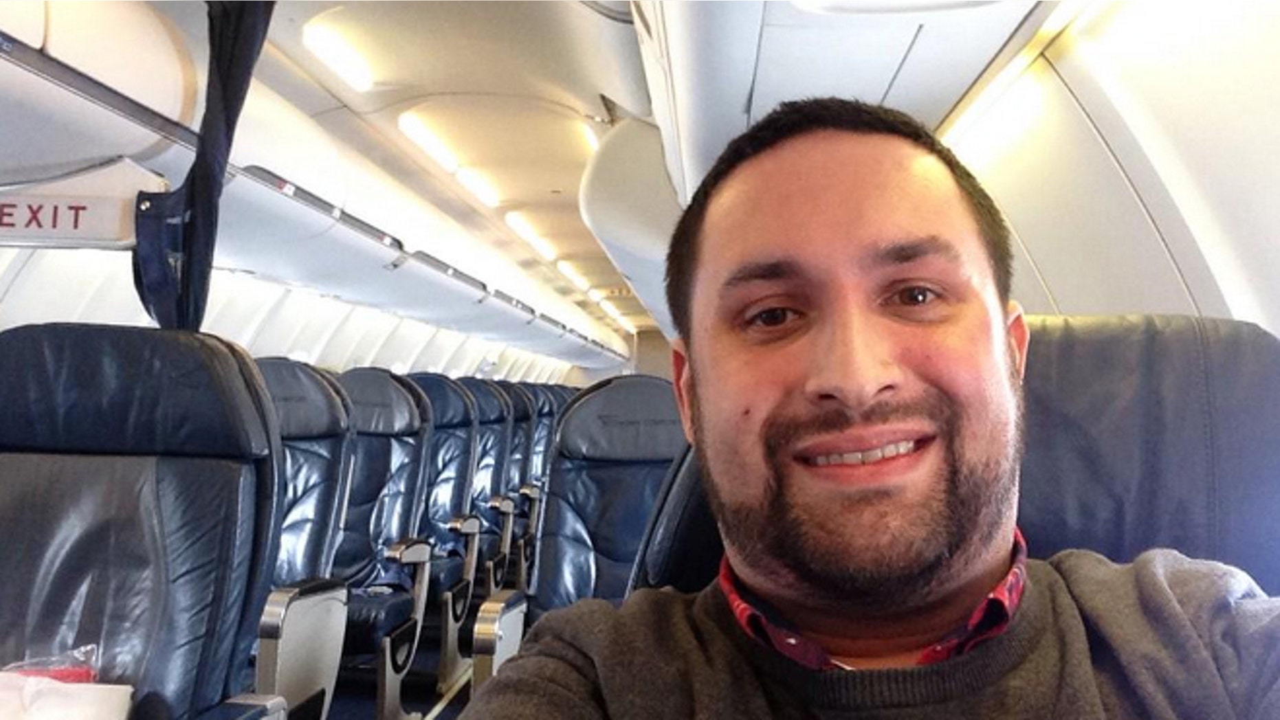 Flying solo: Chris O'Leary snaps a selfie on board his empty flight.