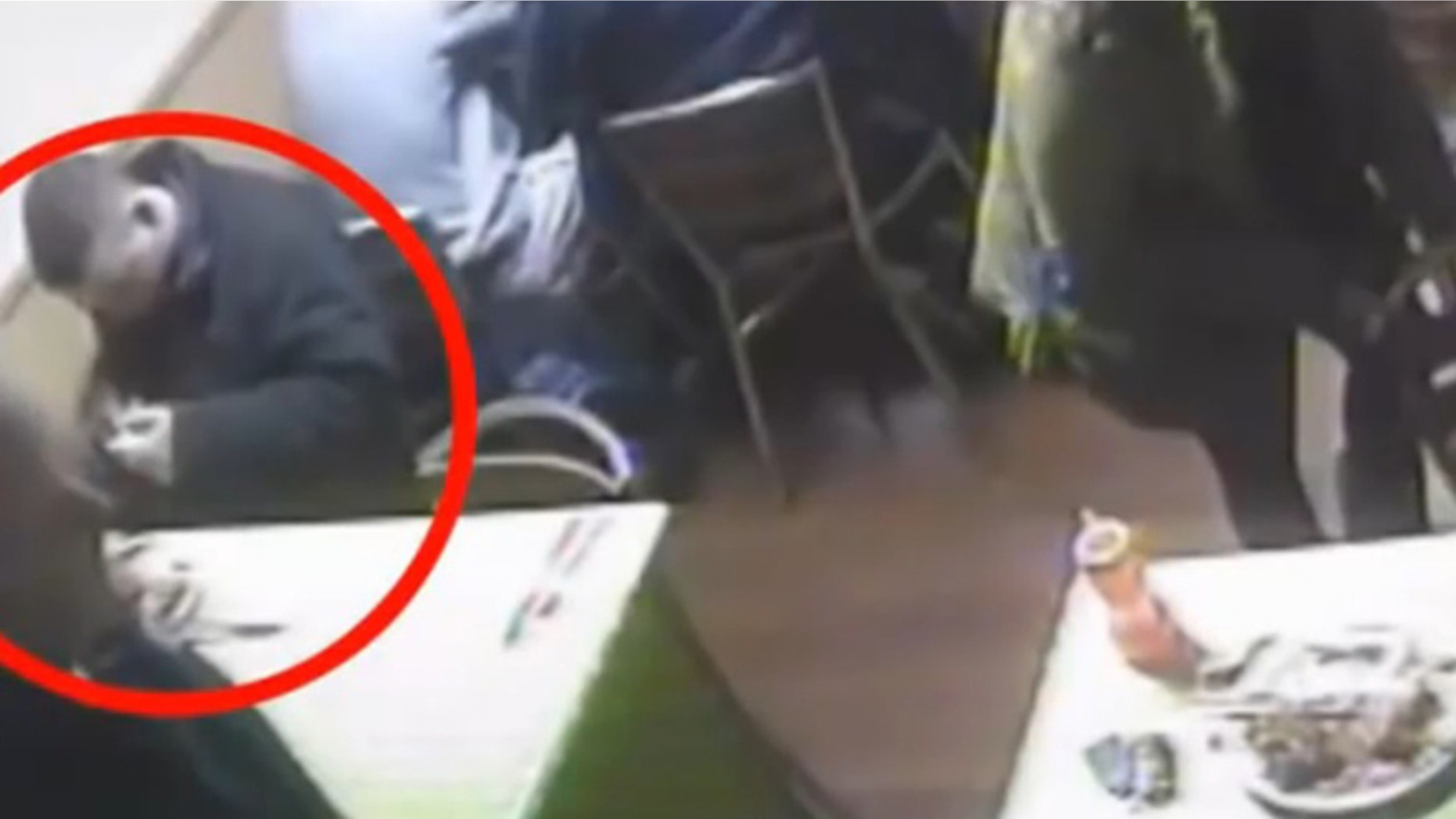 Surveillance footage catches a man pulling a rat from his pocket while dining at a restaurant.