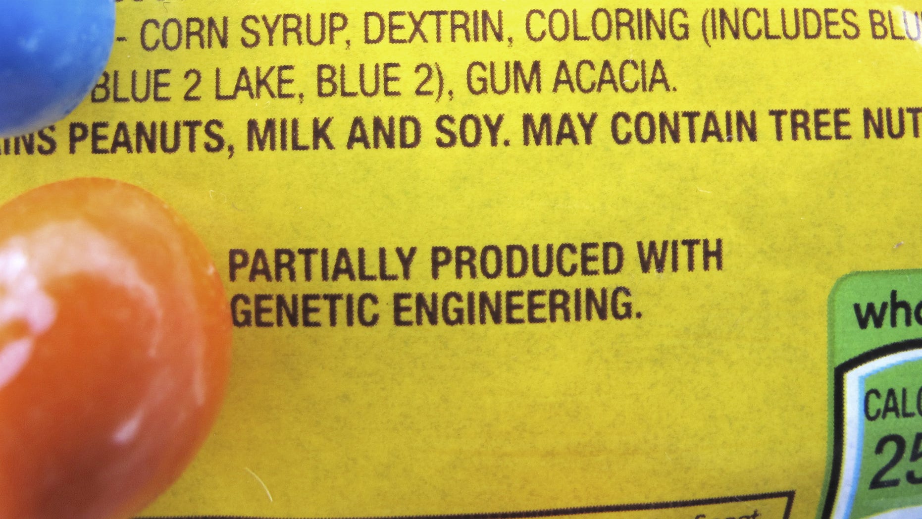 A new disclosure statement is displayed on a package of Peanut M&Ms candy in Montpelier, Vt., saying they are "Partially produced with genetic engineering." On July 1, Vermont became the first state to require the labeling of foods made with genetically modified ingredients.