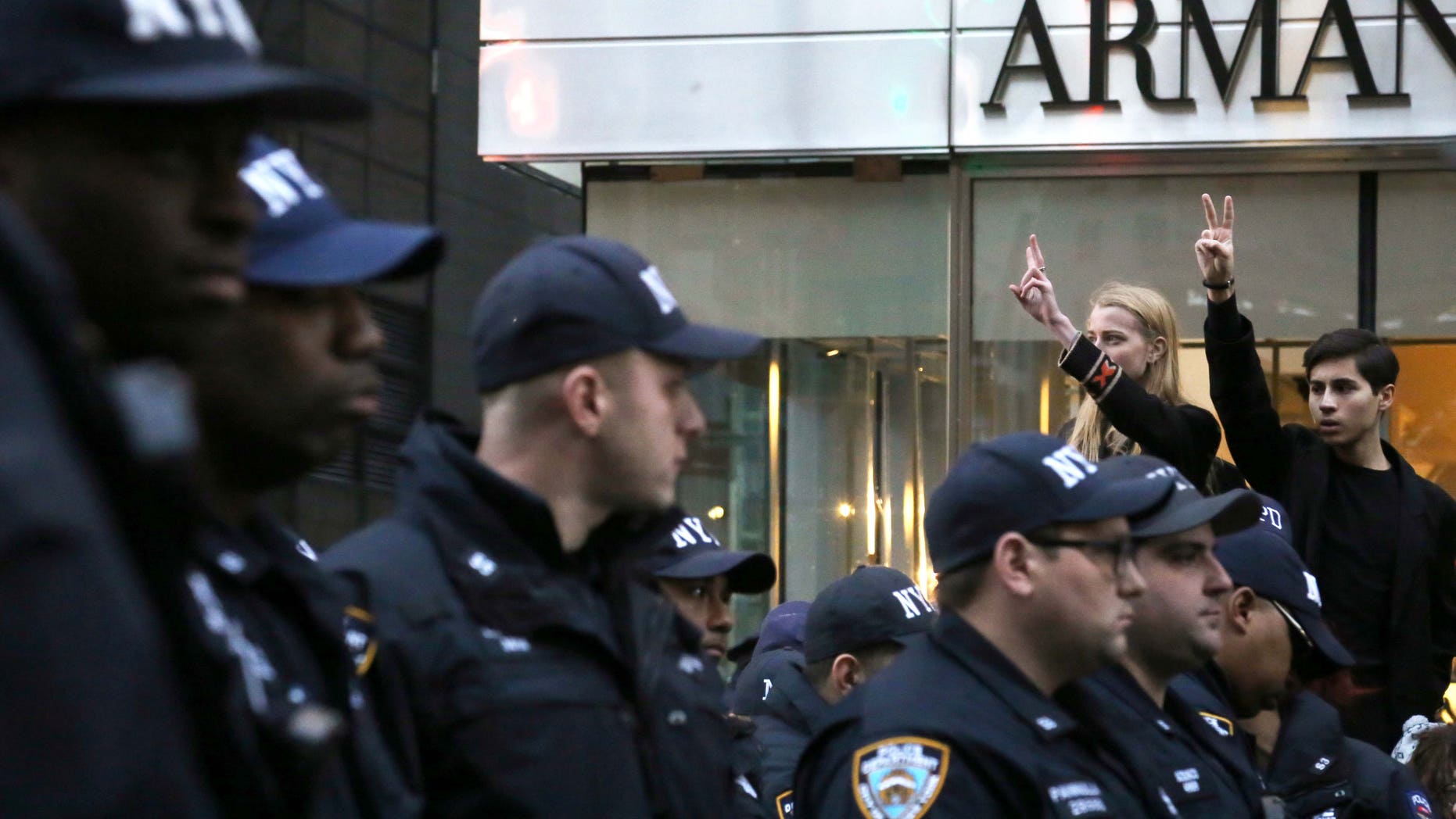 Demonstrators hold up the peace sign during a protest against President-elect Donald Trump in New York City near Trump Tower on Nov. 12, 2016.