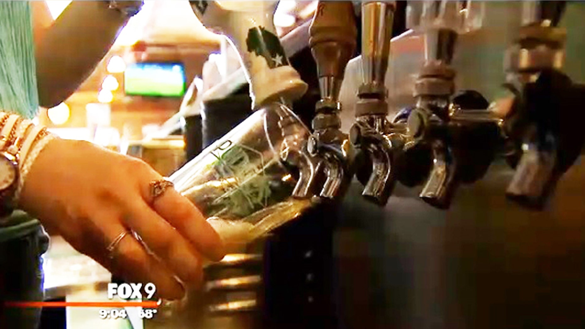 A server at Maple Tavern works the beer tap.