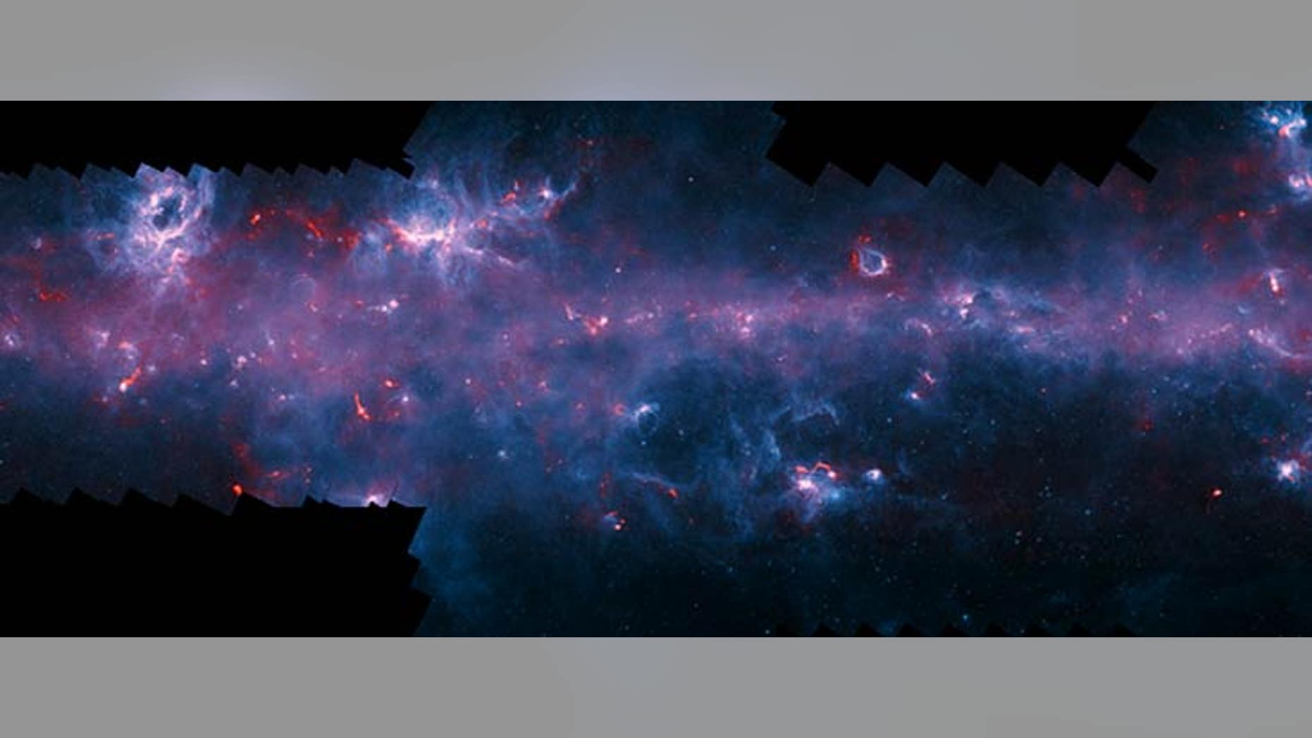 Image of the Milky Way in the direction of the constellation Scorpius with the NGC 6334 (Cat’s Paw Nebula, upper left) and the emission nebula RCW 120 (upper right). (ESO/APEX/ATLASGAL consortium/NASA/GLIMPSE consortium)
