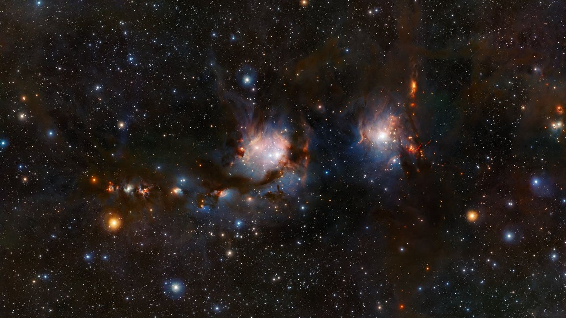 This new view of the star formation region Messier 78 (M78) was taken with the VISTA infrared survey telescope at ESO's Paranal Observatory in Chile. This image shows blue regions of light from the hot young stars, streams of dark dust, and red jets emerging from stars in the process of formation. M78 is the big blue region on the left; another nebula by the name of NGC 2071 is the smaller region on the right.