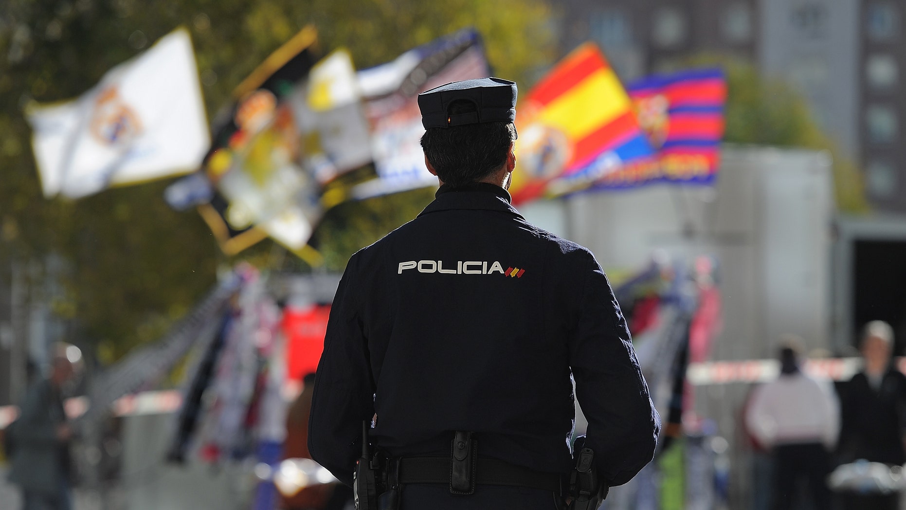 MADRID, SPAIN - NOVEMBER 21: A policeman stands guard outside the Santiago Bernabeu stadium during tight security ahead of the La Liga match between Real Madrid and Barcelona at Estadio Santiago Bernabeu on November 21, 2015 in Madrid, Spain. (Photo by Denis Doyle/Getty Images)