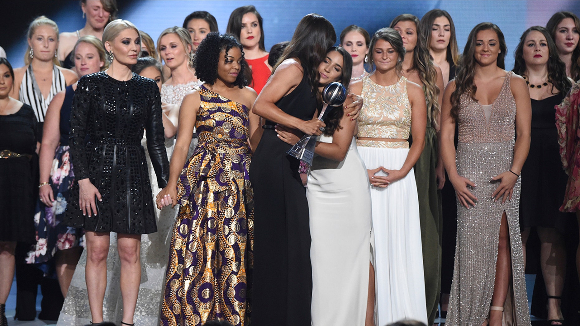 Jennifer Garner, front, embraces gymnast Aly Raisman after presenting the Arthur Ashe Award for Courage, at the ESPY Awards at Microsoft Theater on Wednesday, July 18 in Los Angeles.