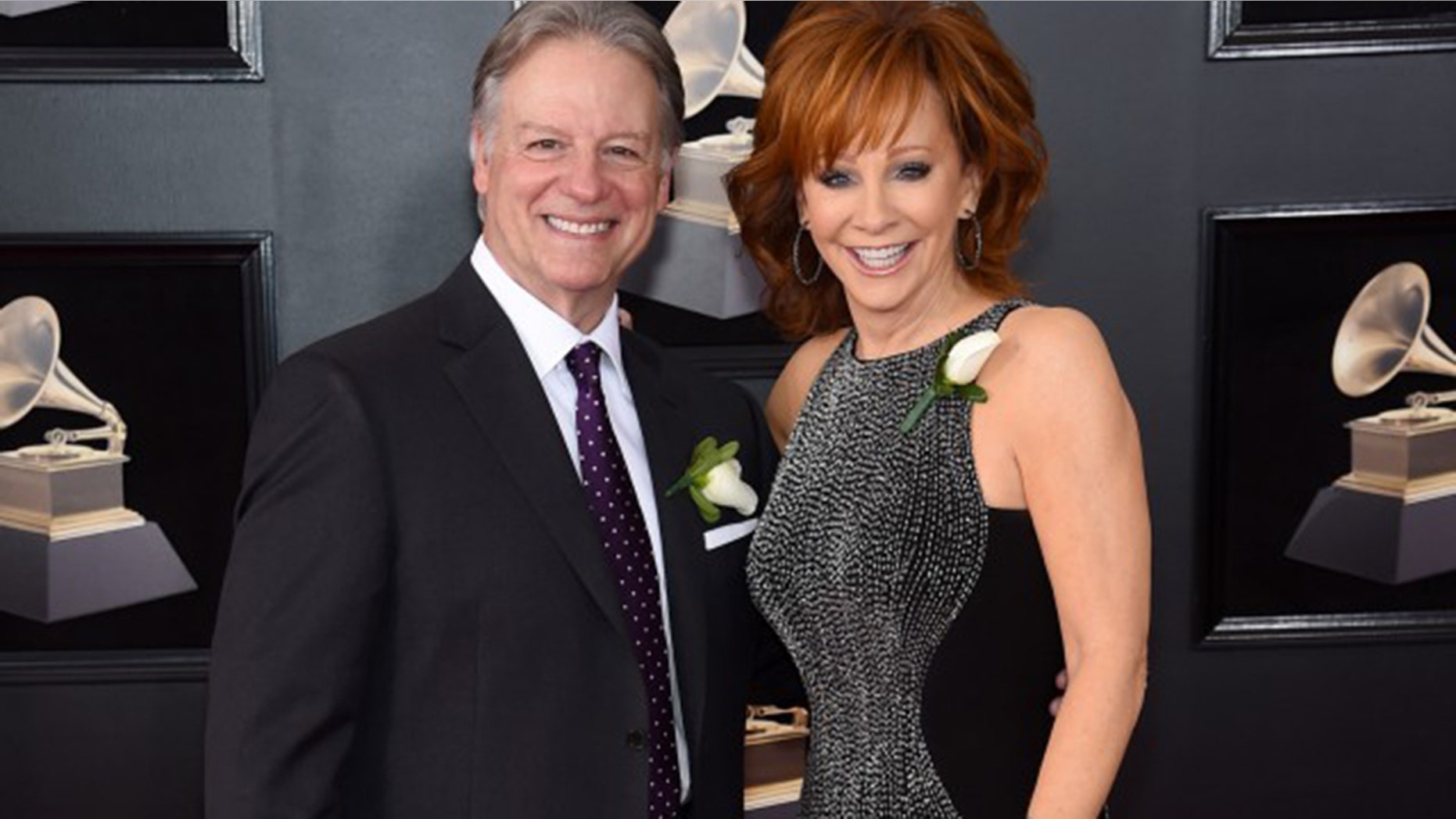 Reba walked the Grammys red carpet with her new boyfriend Anthony Lasuzzo.