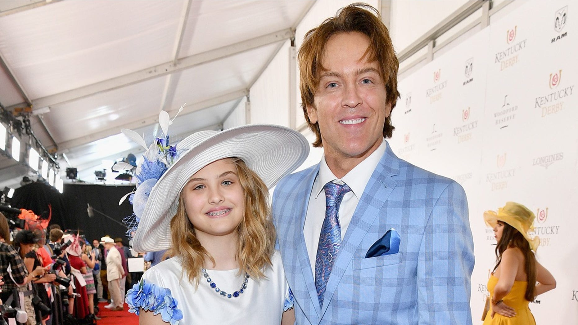 Dannielynn Birkhead (left) and Larry Birkhead attend the Kentucky Derby.