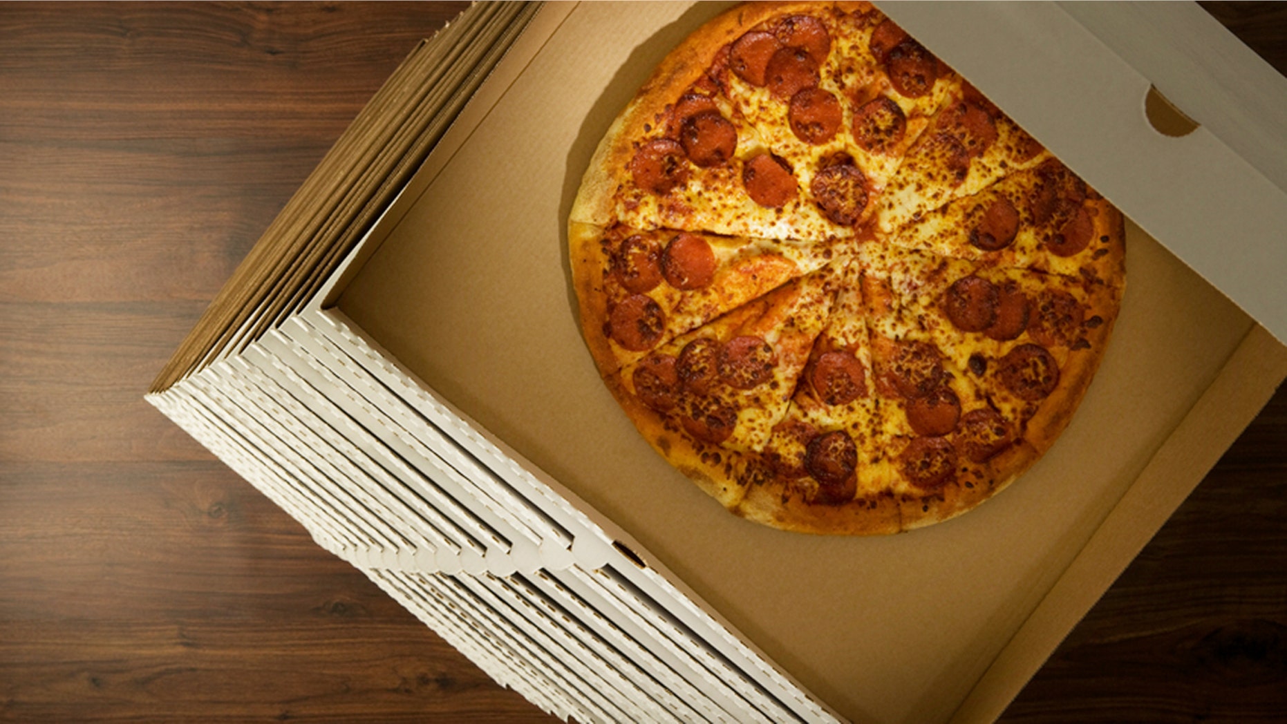 An Indianapolis pizza shop owner is hoping to reduce crime rates through food.