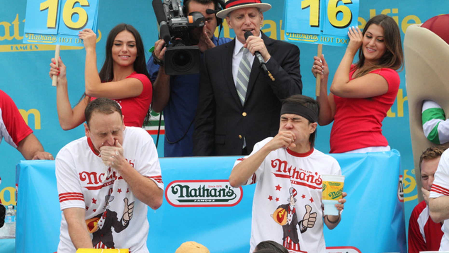 Joey Chestnut, left, and Matt Stonie face off in Nathan's Famous Fourth of July International Hot Dog Eating Contest men's competition, July 4, 2015.