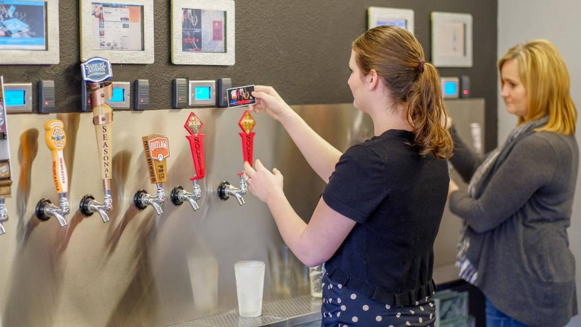 Bar goers test out the newly installed system.