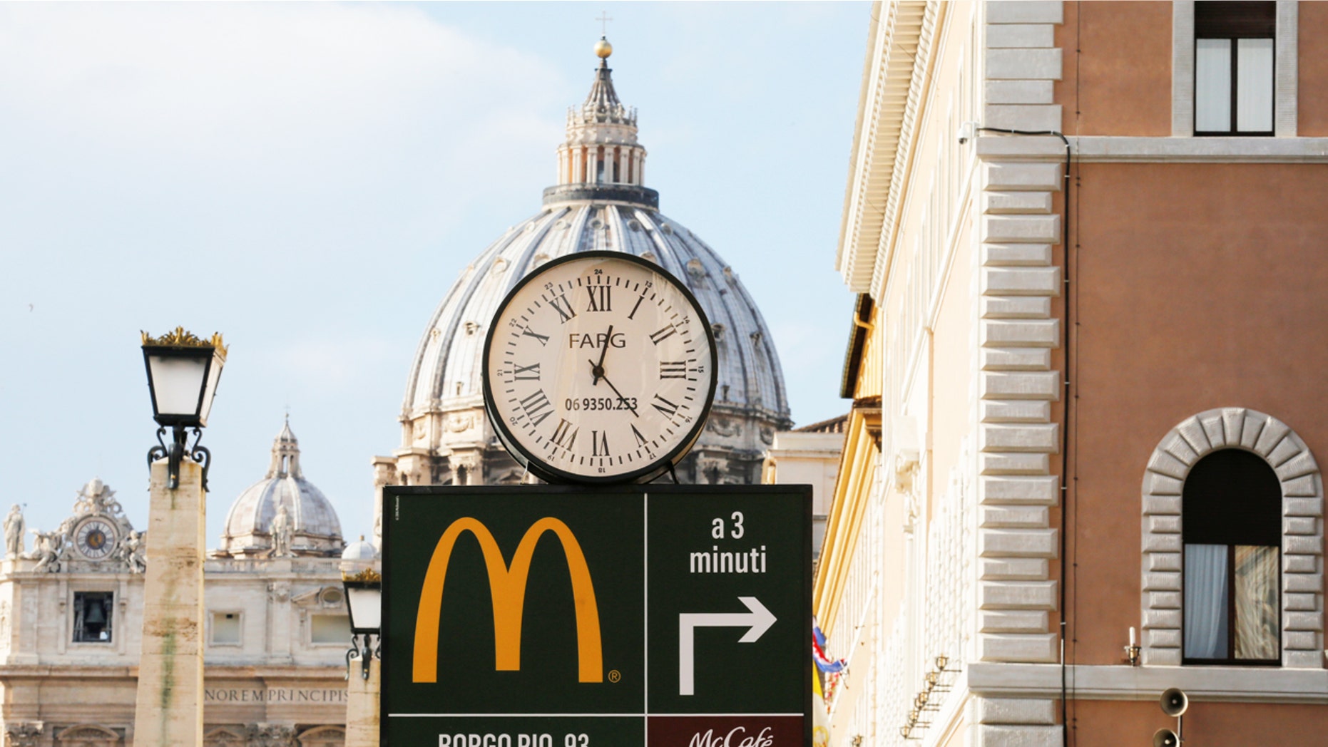 A McDonald's sign is seen at Via della Conciliazione street in Rome, Italy in front of Vatican City's St. Peter's Square Jan. 3, 2017.