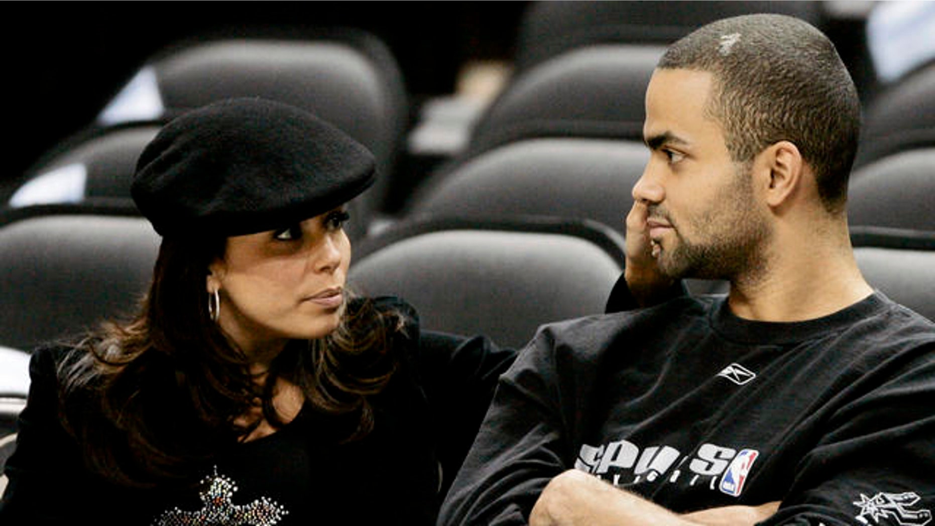 San Antonio Spurs guard Tony Parker, right, of France, sits with his girlfriend and "Desperate Housewives" co-star Eva Longoria prior to the team's NBA basketball game against the Seattle SuperSonics in San Antonio, Tuesday, April 11, 2006. (AP Photo/Eric Gay)