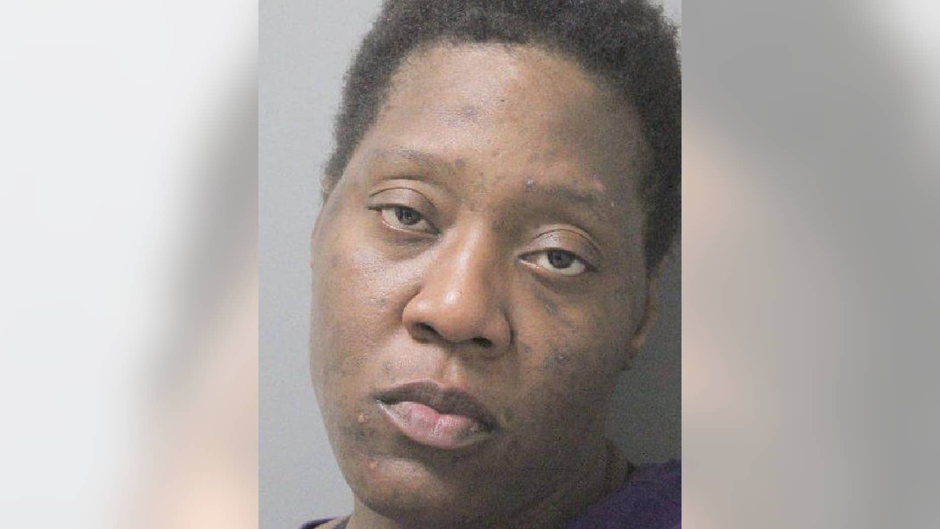 Evelyn Washington was charged with burglary after she was busted in another woman's home taking a bath and eating some Cheetos, police say.