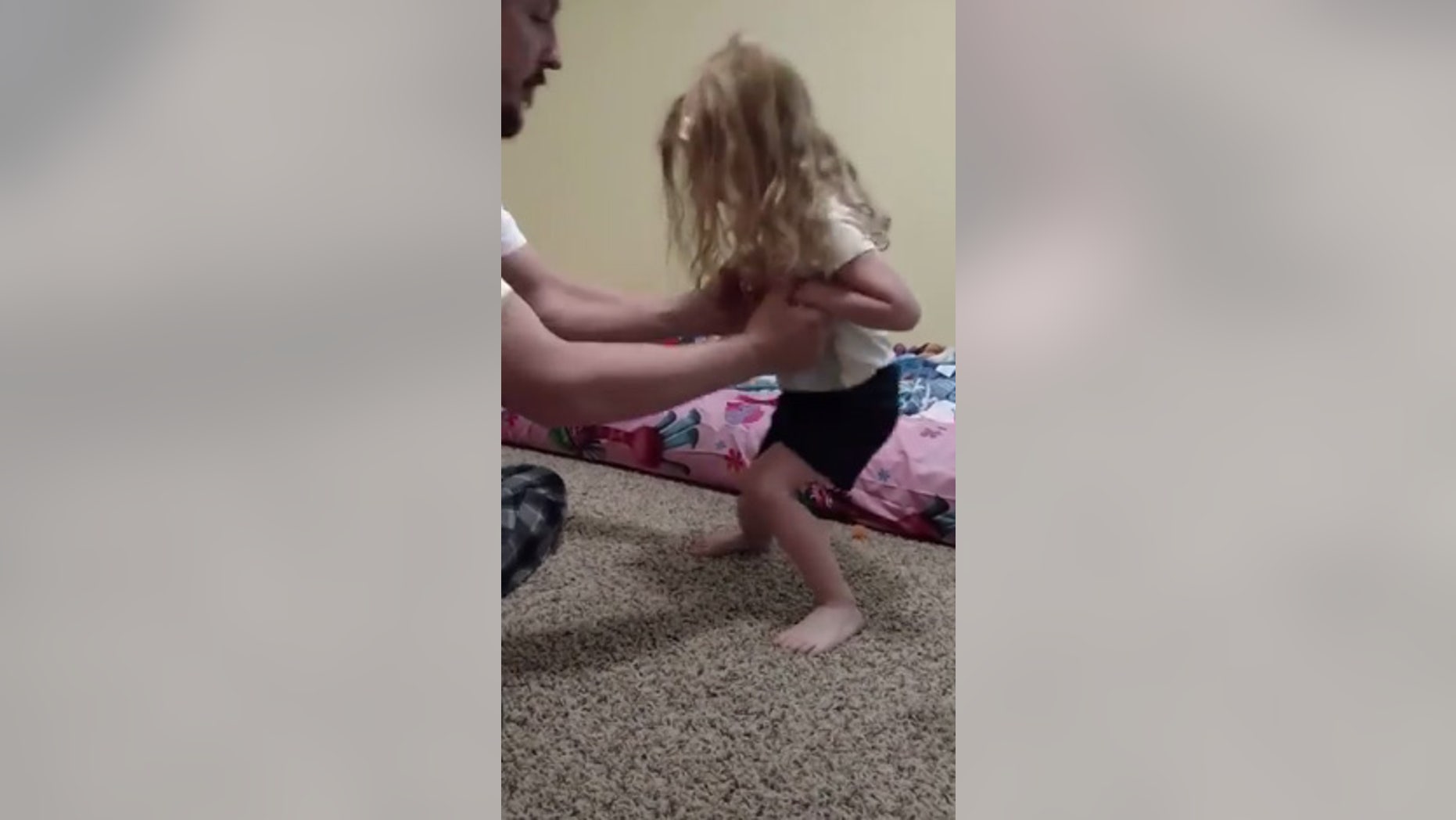 After being bit by a tick, Evelyn, above, struggled to stand on her own.
