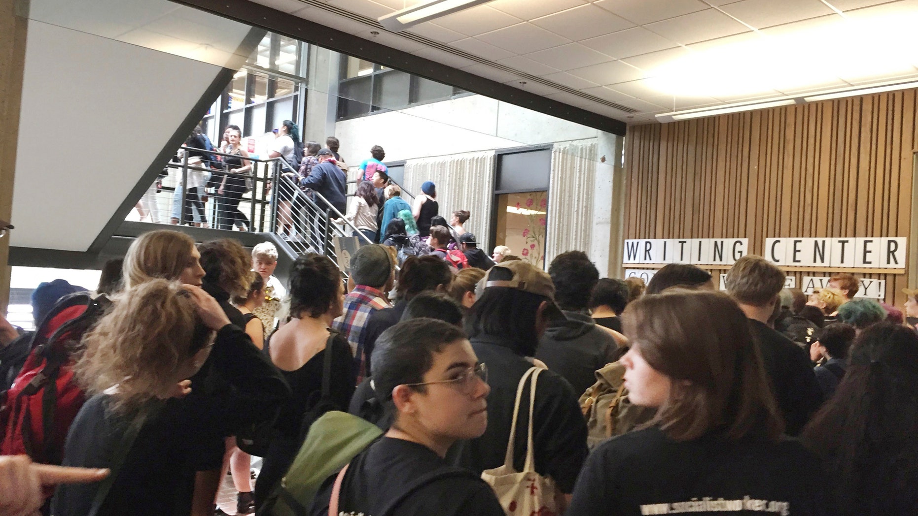 In this Wednesday, May 24, 2017, photo, after weeks of brewing racial tension on campus, hundreds of students at the Evergreen State College in Olympia, Wash., protest against the college administration and demanded change.