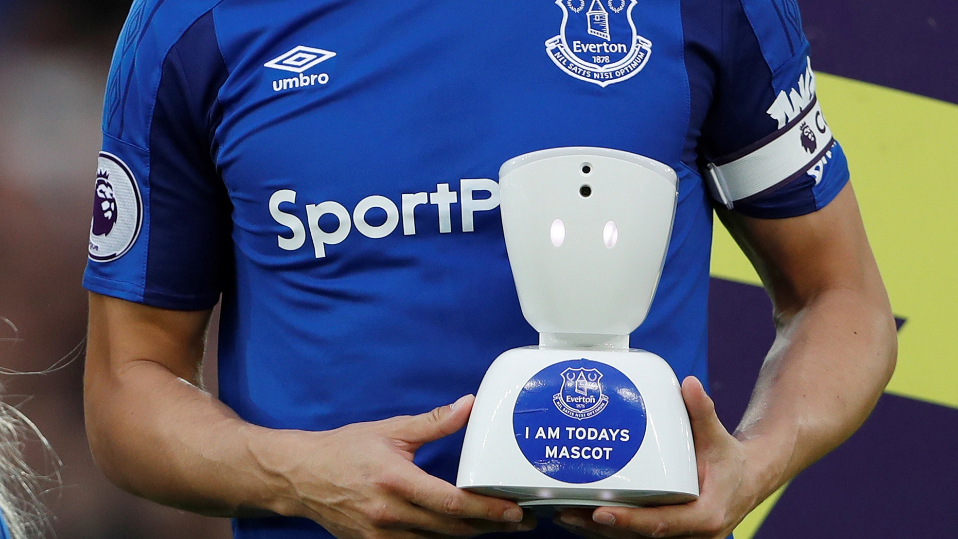 Everton v Newcastle United - Goodison Park, Liverpool, Britain - April 23, 2018 Everton's Phil Jagielka with a robot mascot before the match (Action Images via Reuters/Lee Smith)