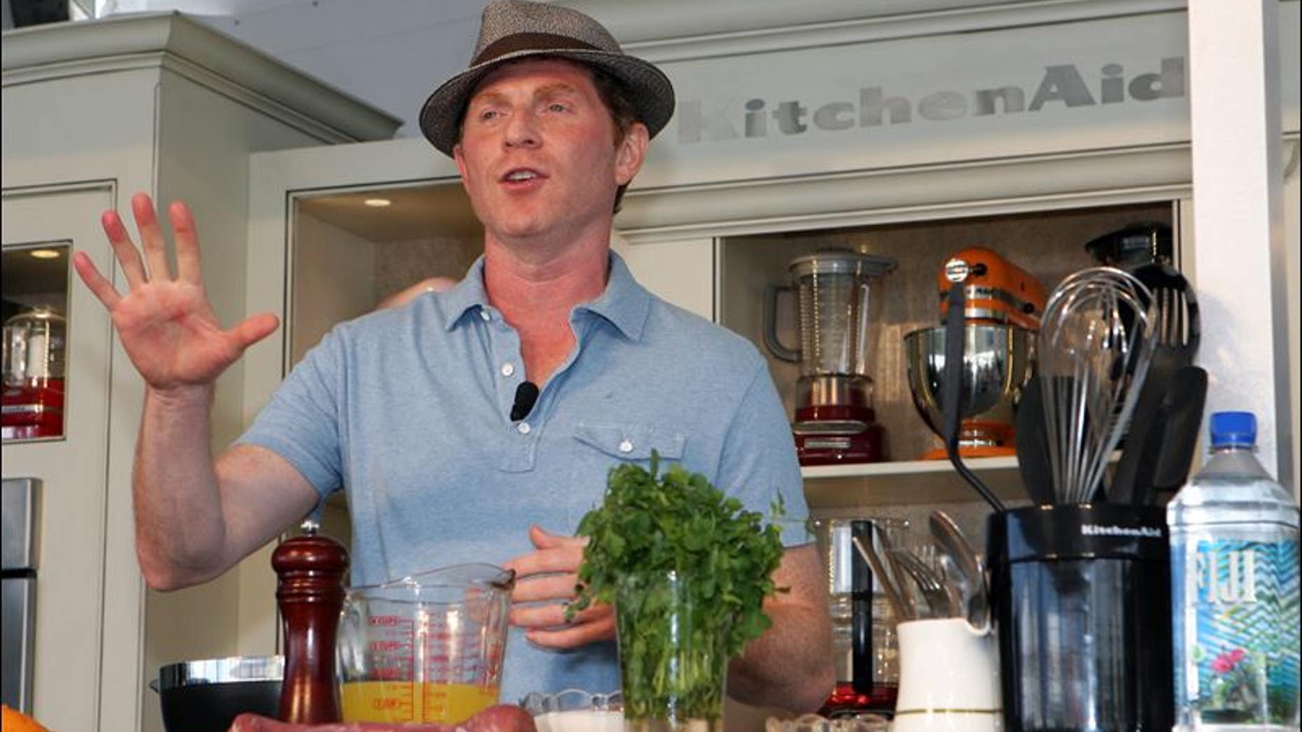 Food Network star Bobby Flay performs an outdoor kitchen demo at the South Beach Wine & Food Festival in Miami.