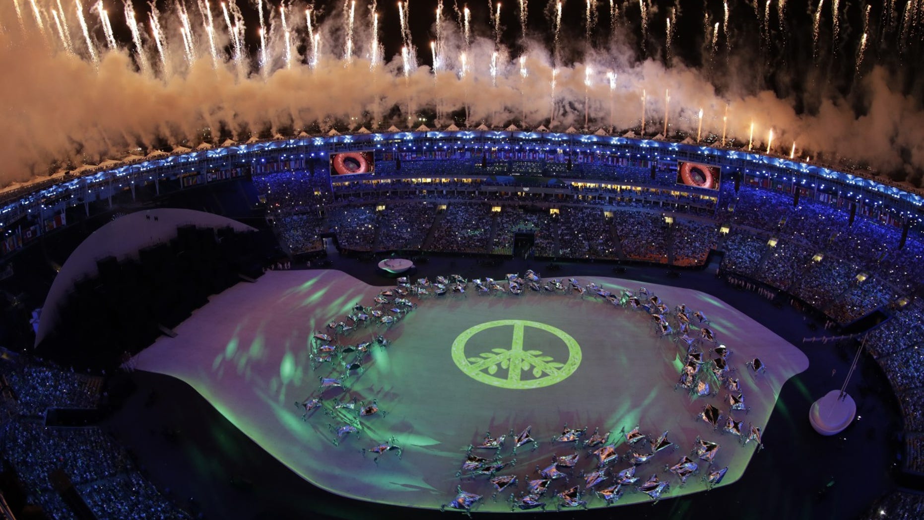 Fireworks light up the night sky over Maracana Stadium during the opening ceremony at the 2016 Summer Olympics in Rio de Janeiro, Brazil, Friday, Aug. 5, 2016.