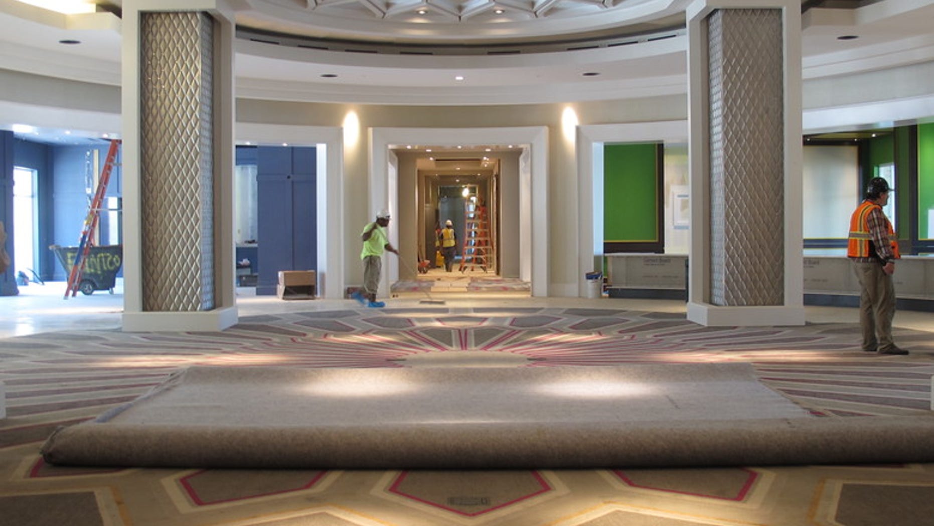 n this Aug. 8, 2016 photo, workers are seen in the circular lobby area of the new 450-room Guest House at Graceland in Memphis, Tenn. Elvis Presley used to dream about building a guest house at his Graceland property, for friends who would visit the rock and roll icon in Memphis. Presley didn't get to see his dream come true, but his fans will.