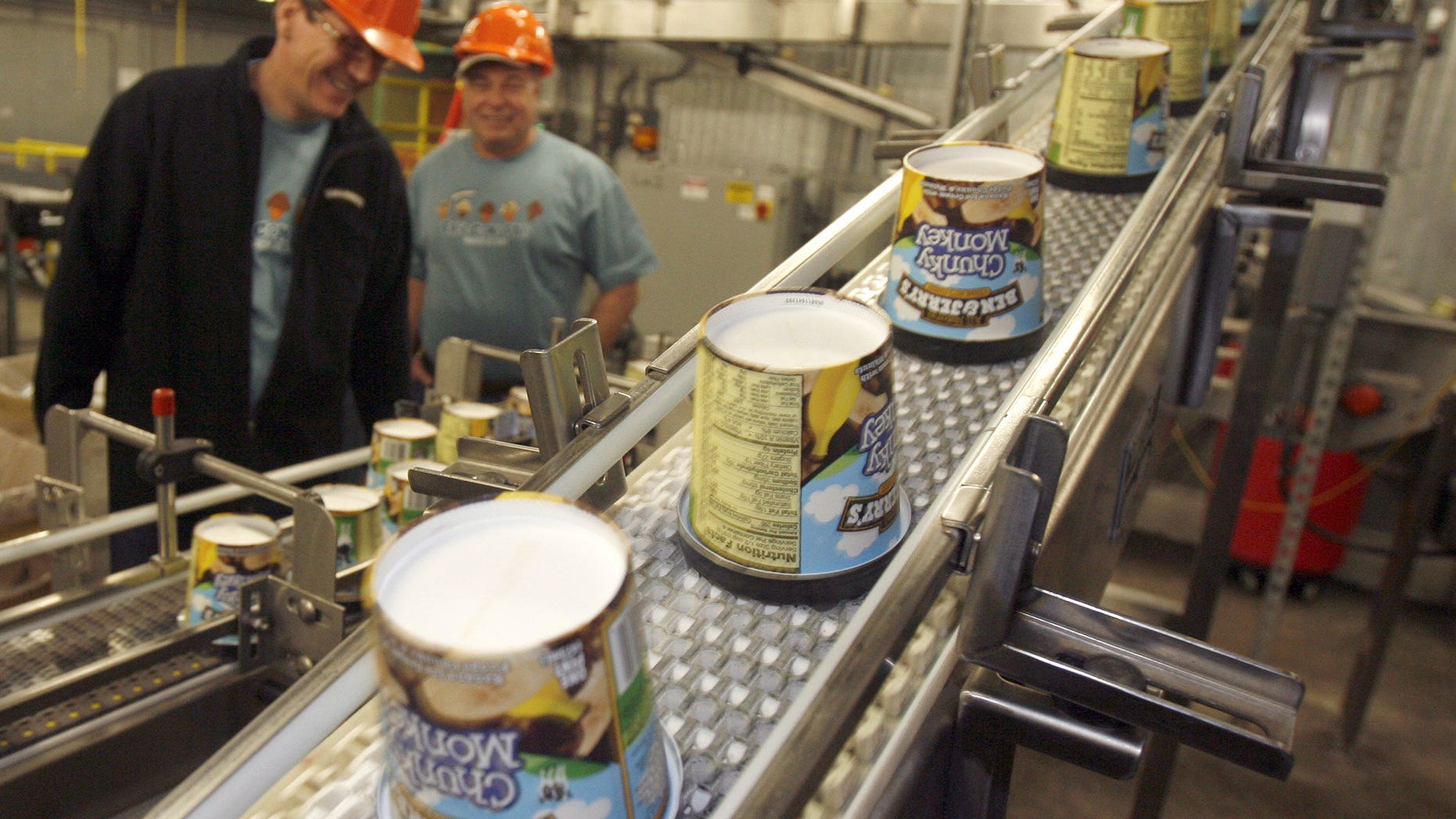 Chunky Monkey ice cream pints move along the production line at Ben & Jerry's factory in Waterbury, Vt.