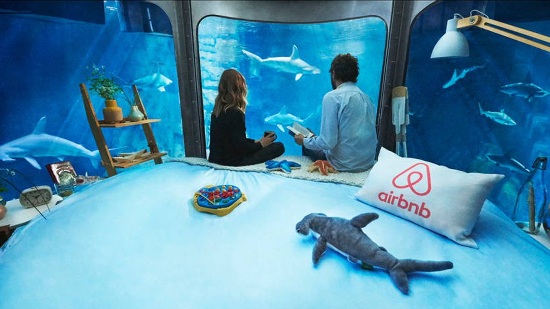 Spend a night in the shark tank at the Paris Aquarium.