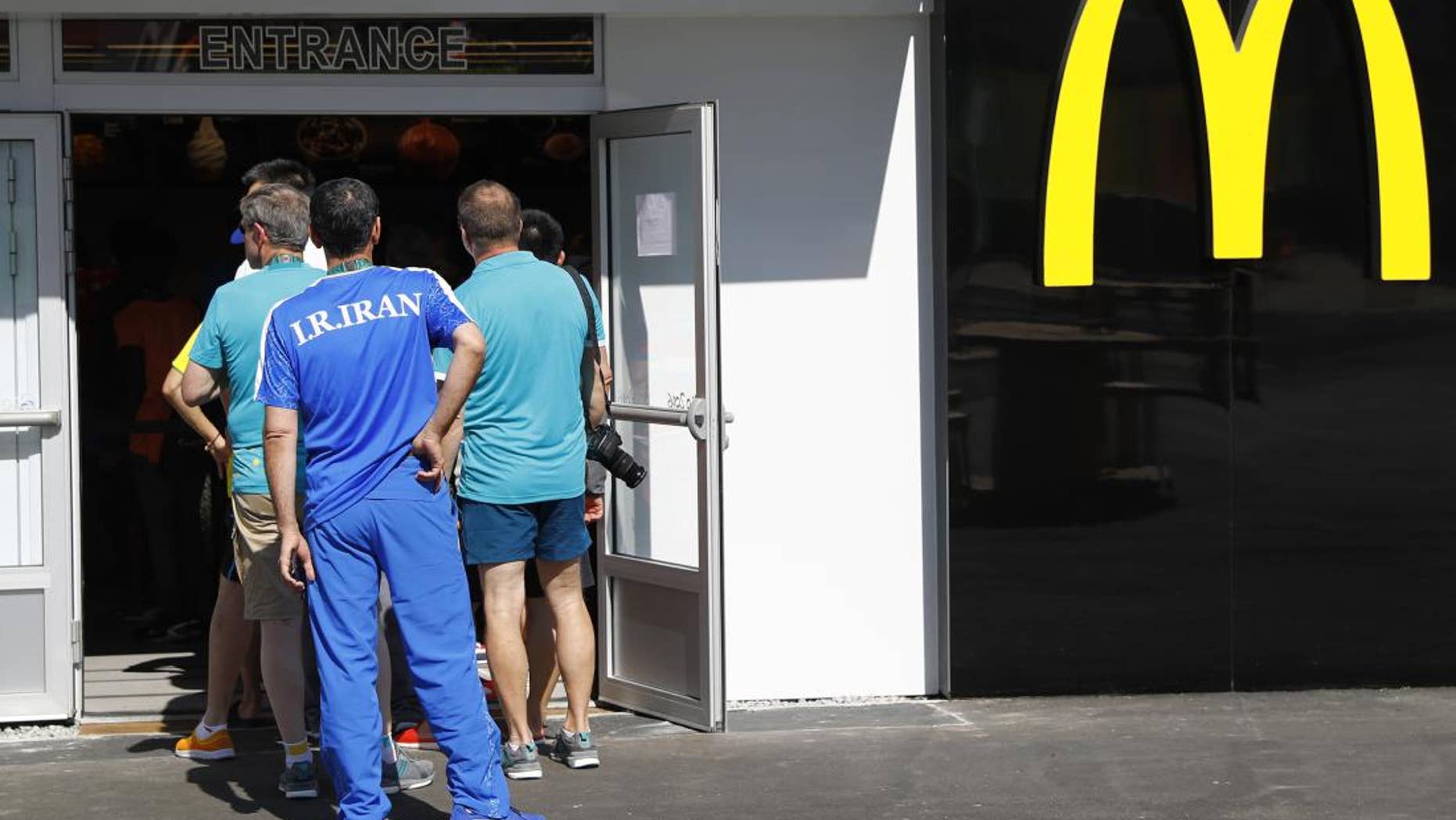 A line forms outside the Olympic Village McDonald's outpost in Rio de Janeiro, Brazil.