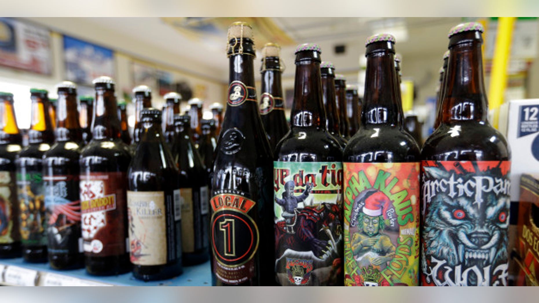 A selection of craft beers dot the shelves of Elite Beverages in Indianapolis, Ind. Craft beers now account for approximately 20 percent of the domestic beer market share.