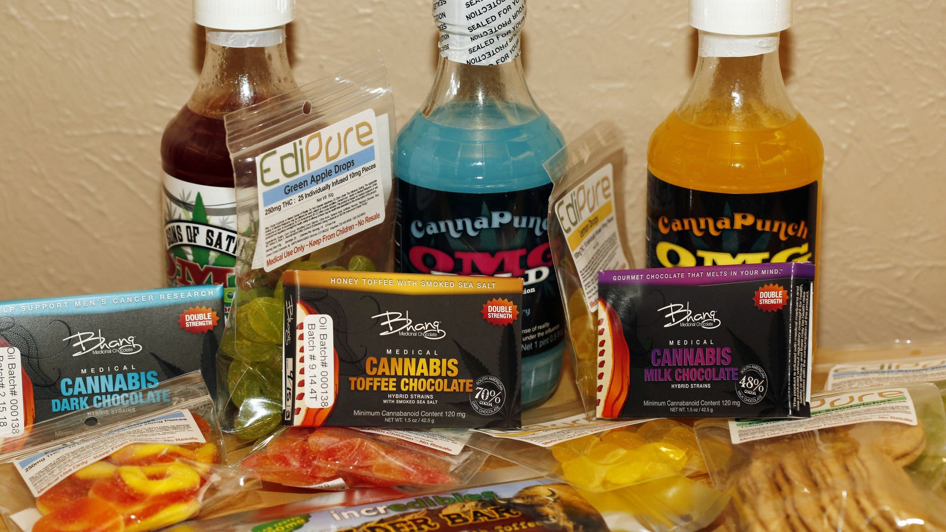 A sample of marijuana-infused edible including fruit gummies, chocolate and beverages.