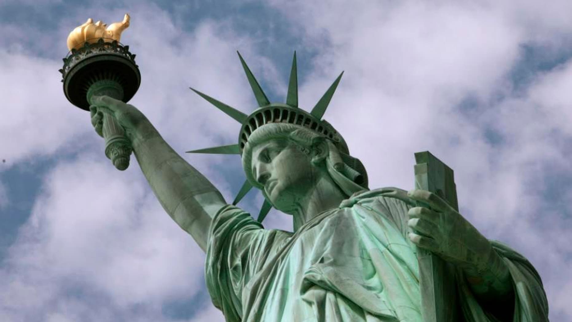 In this June 2, 2009 photo, the Statue of Liberty is seen in New York harbor. The crown is set to open July 4 after being closed since shortly after the Sept. 11, 2001, terrorist attacks. (AP Photo/Richard Drew)