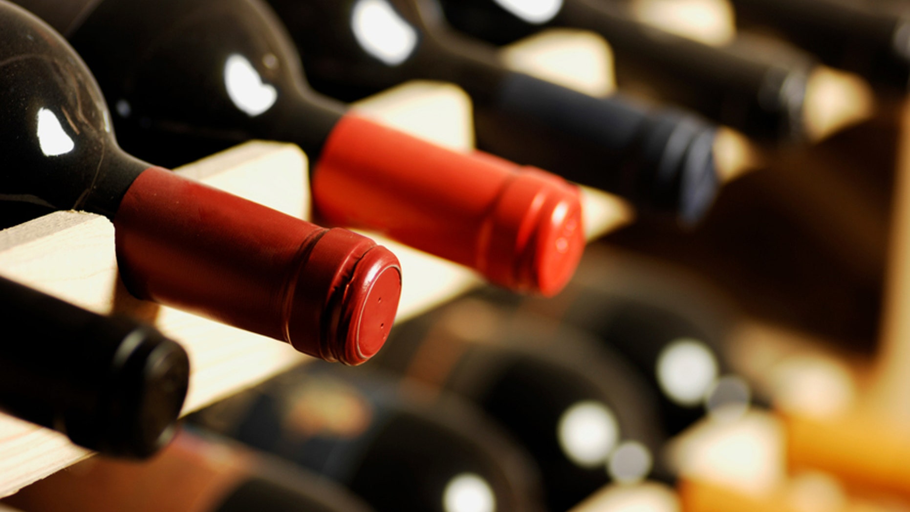 Wine bottles stored in a shelf, very shallof DoF