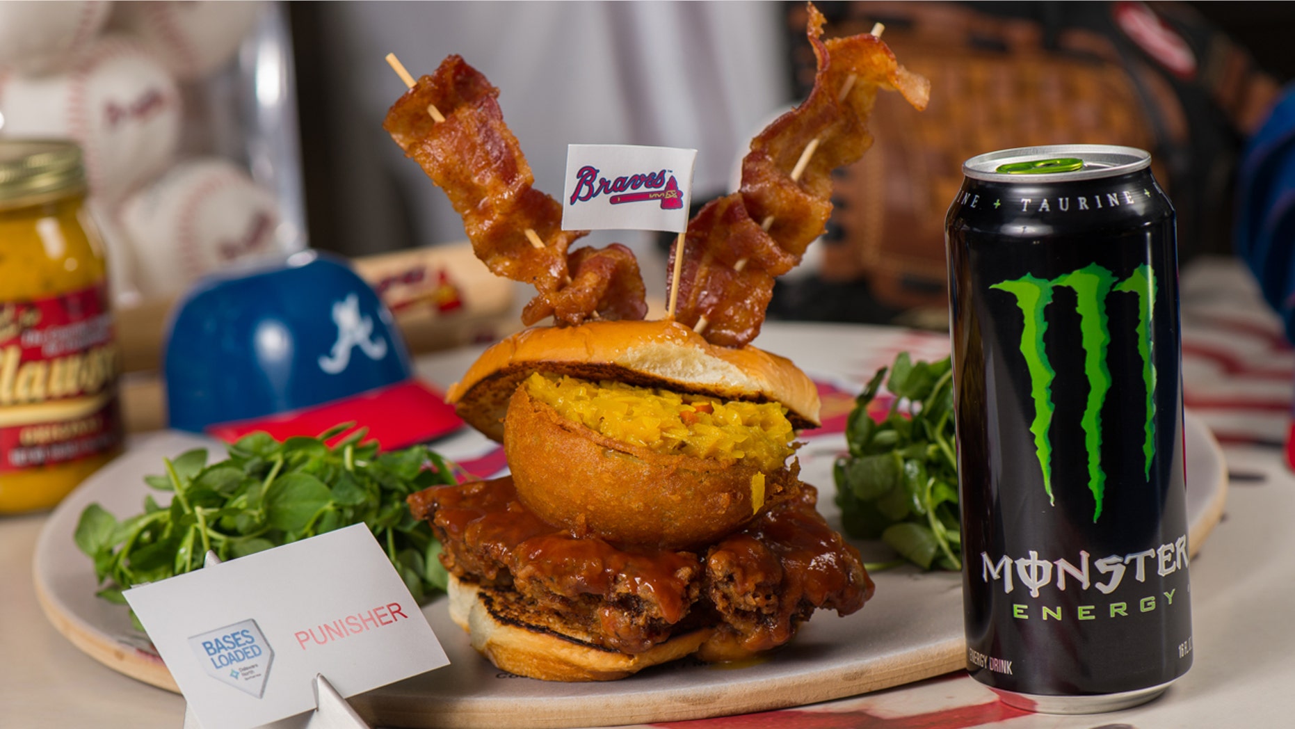 The Atlanta Braves want to "punish" you with this giant sandwich glazed with Monster energy-drink infused barbecue sauce.