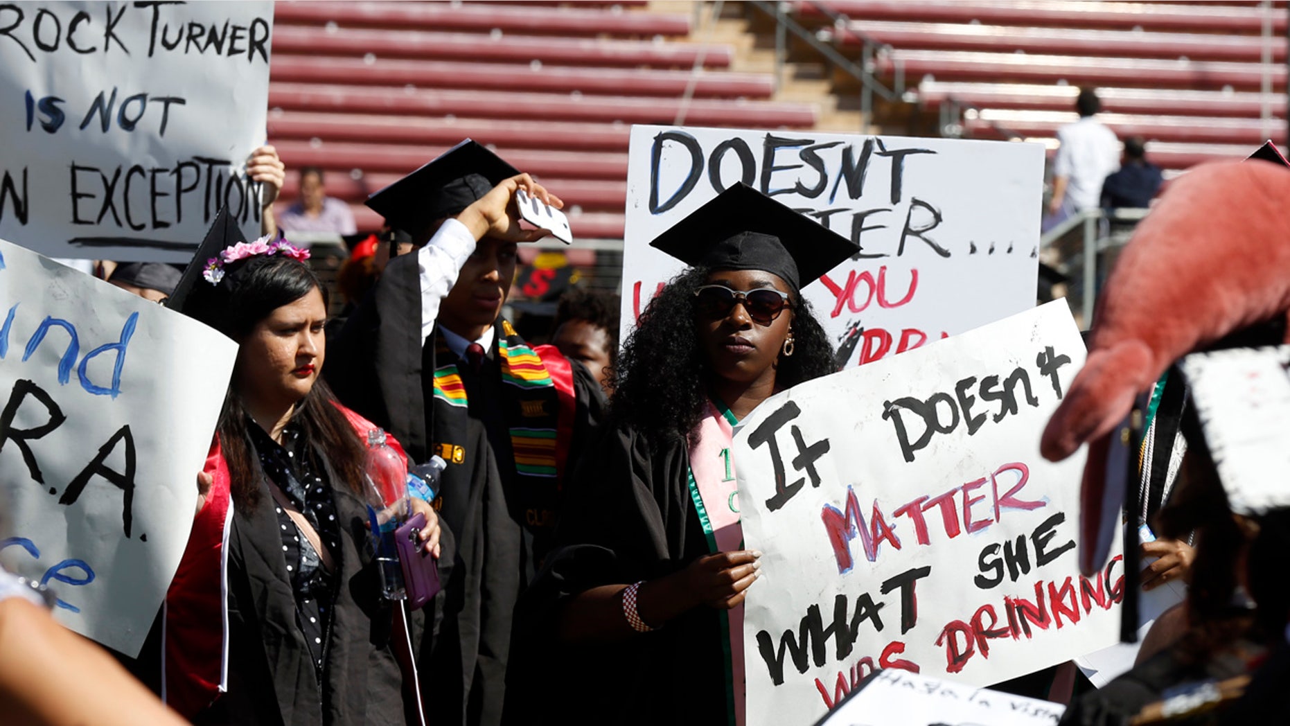 June 12, 2016: Protesters demonstrate during Stanford University graduation exercises at Stanford Stadium in Stanford, Calif.