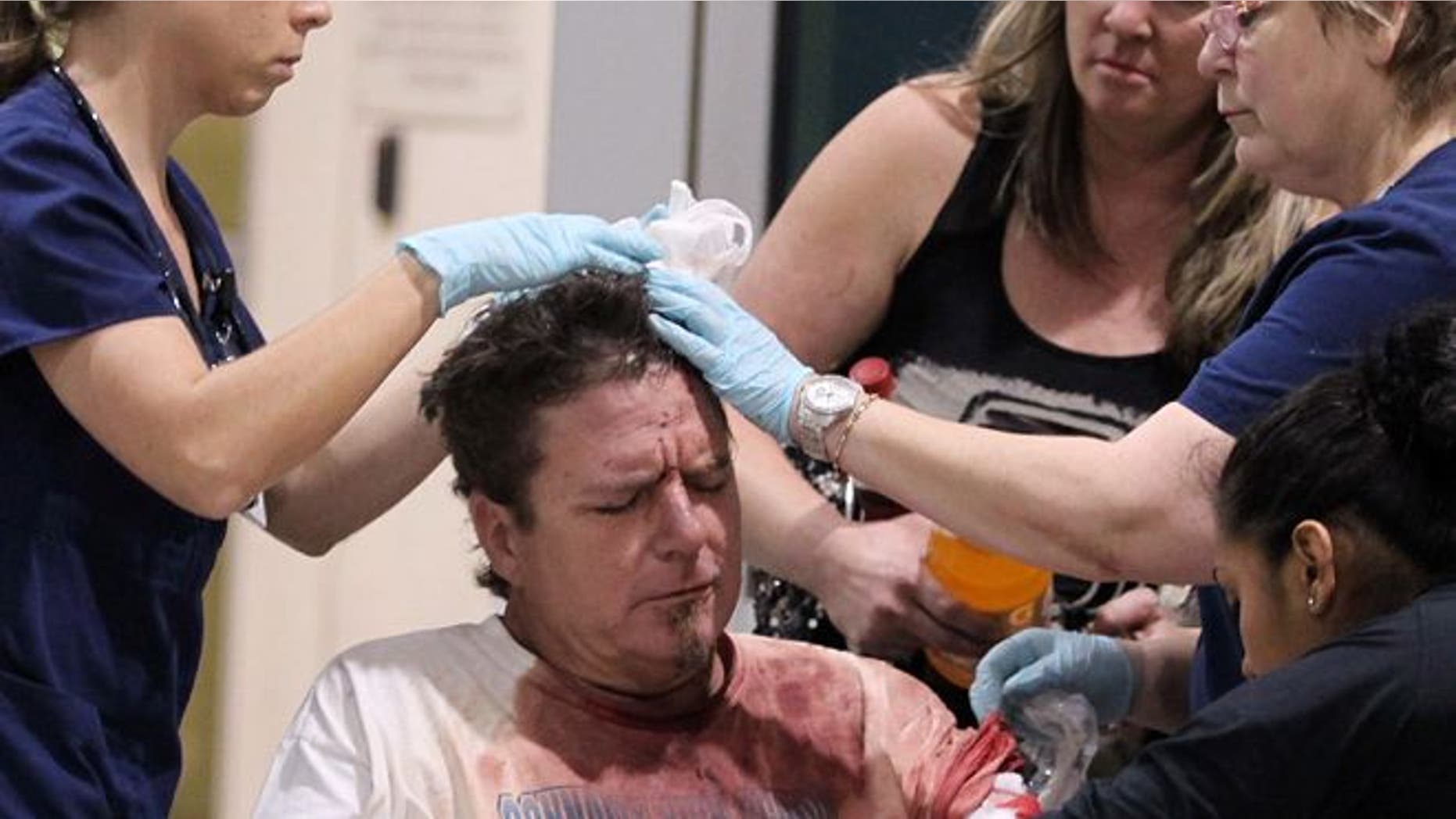 April 17, 2013: An unidentified man injured by the West fertilizer plant explosion is treated by nurses from Hillcrest Baptist Medical Hospital in Waco, Texas. (AP /Waco Tribune Herald)