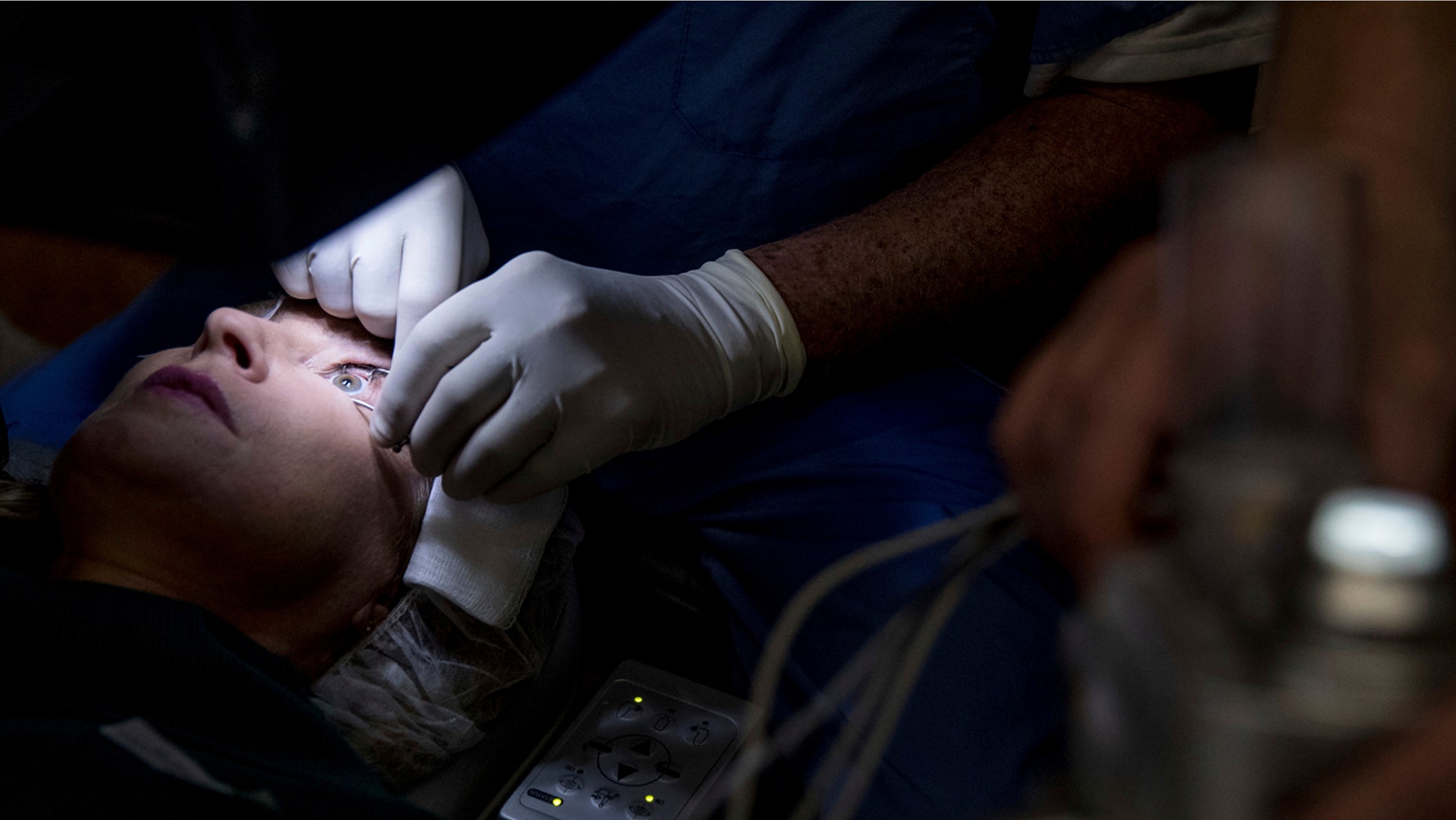 Feb. 1, 2017: Dr. Mark Whitten performs a short eye surgery procedure on patient Christianne Krupinsky in Washington.