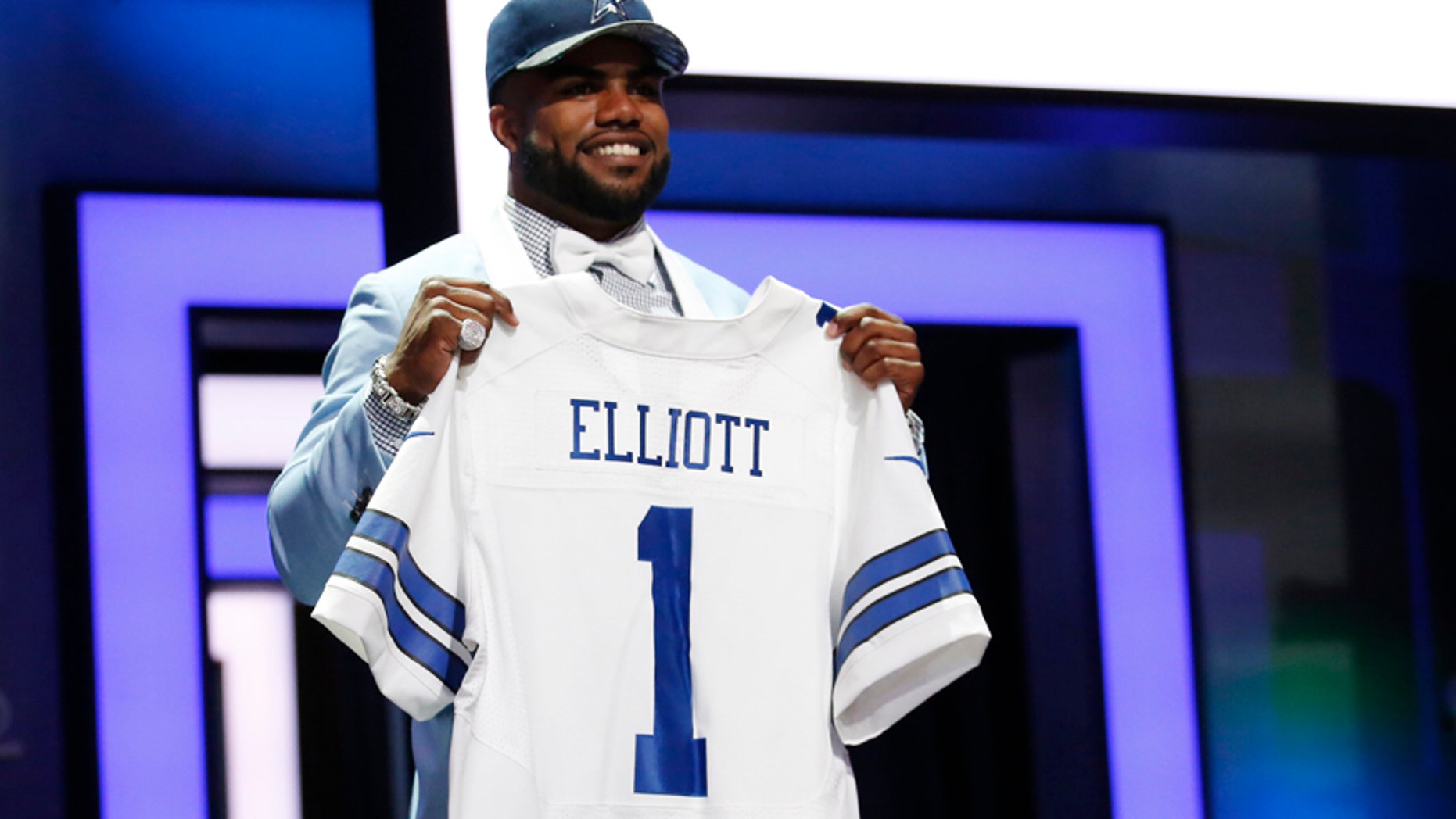 Apr 28, 2016; Chicago, IL, USA; Ezekiel Elliott (Ohio State) after being selected by the Dallas Cowboys as the number four overall pick in the first round of the 2016 NFL Draft at Auditorium Theatre. (Kamil Krzaczynski-USA TODAY Sports via Reuters)