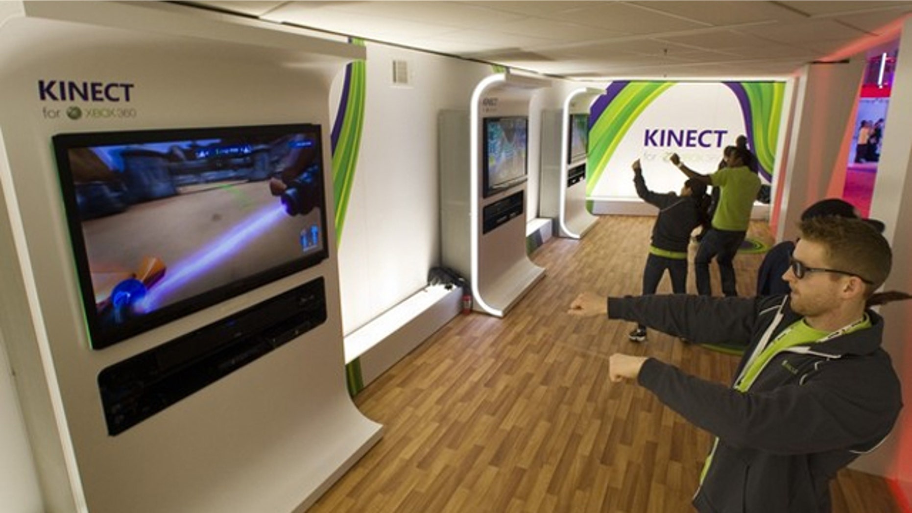 Gamers test out Microsoft's Xbox Kinect.
