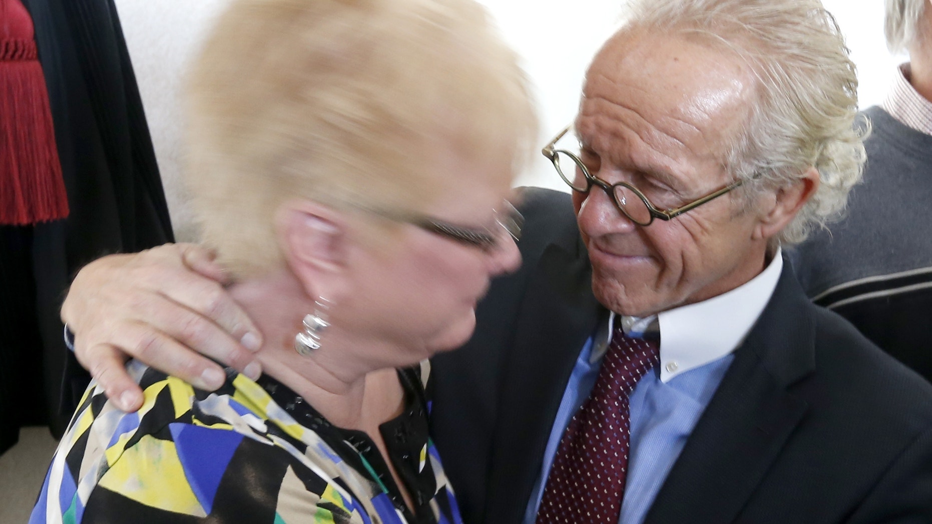 Jan. 21, 2014: Attorney Jeff Anderson, right, smiles after hugging Kathy Laarveld, whose son was sexually abused by a priest, after a news conference on the release of files of Catholic priests credibly accused of sexually abusing minors in the Archdiocese of Chicago, in Chicago.