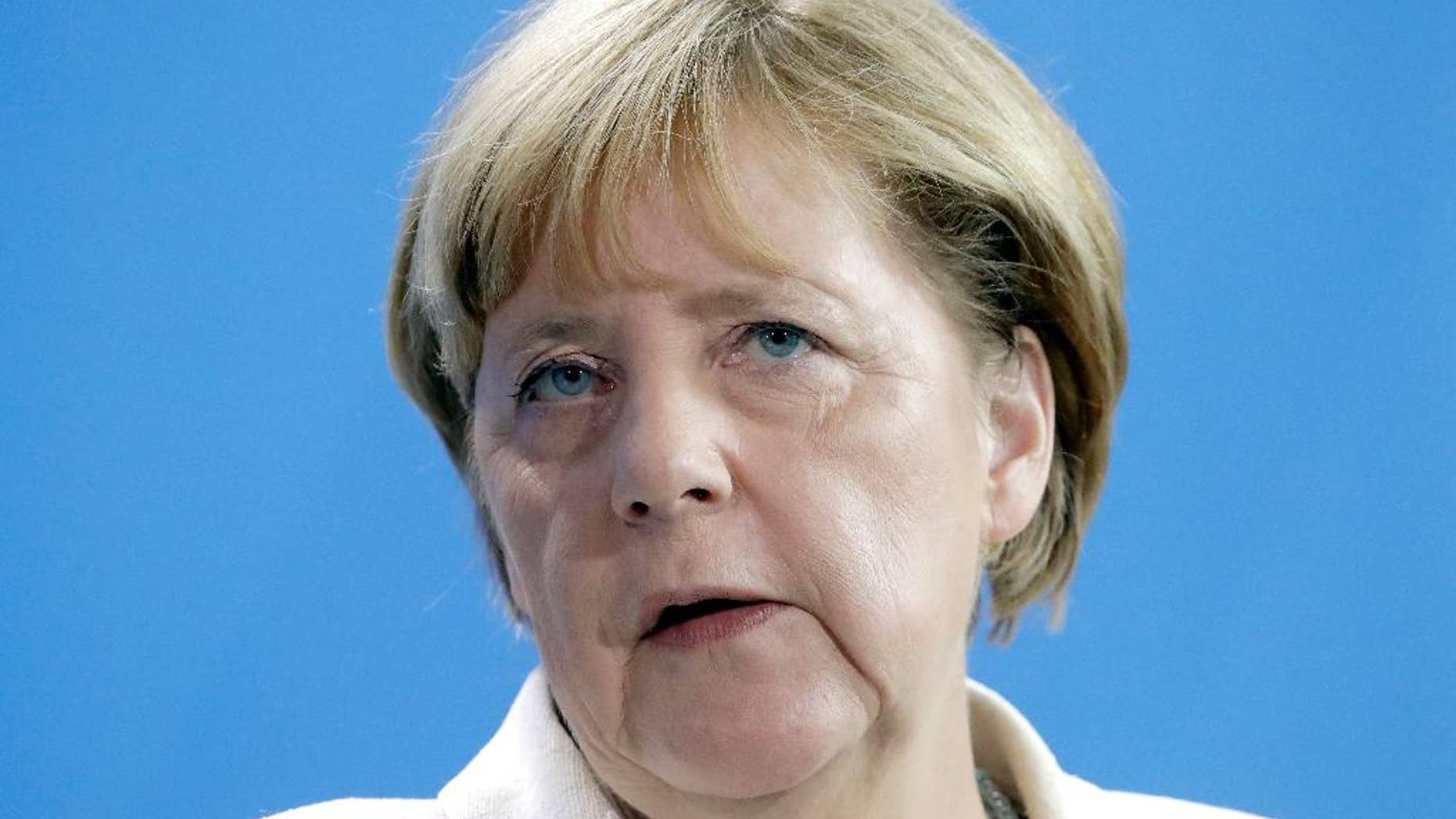 German Chancellor Angela Merkel speaks during a joint news conference as part of a meeting with the President of Turkmenistan, Gurbanguly Berdimuhamedow at the chancellery in Berlin, Germany, Monday, Aug. 29, 2016. (AP Photo/Michael Sohn)